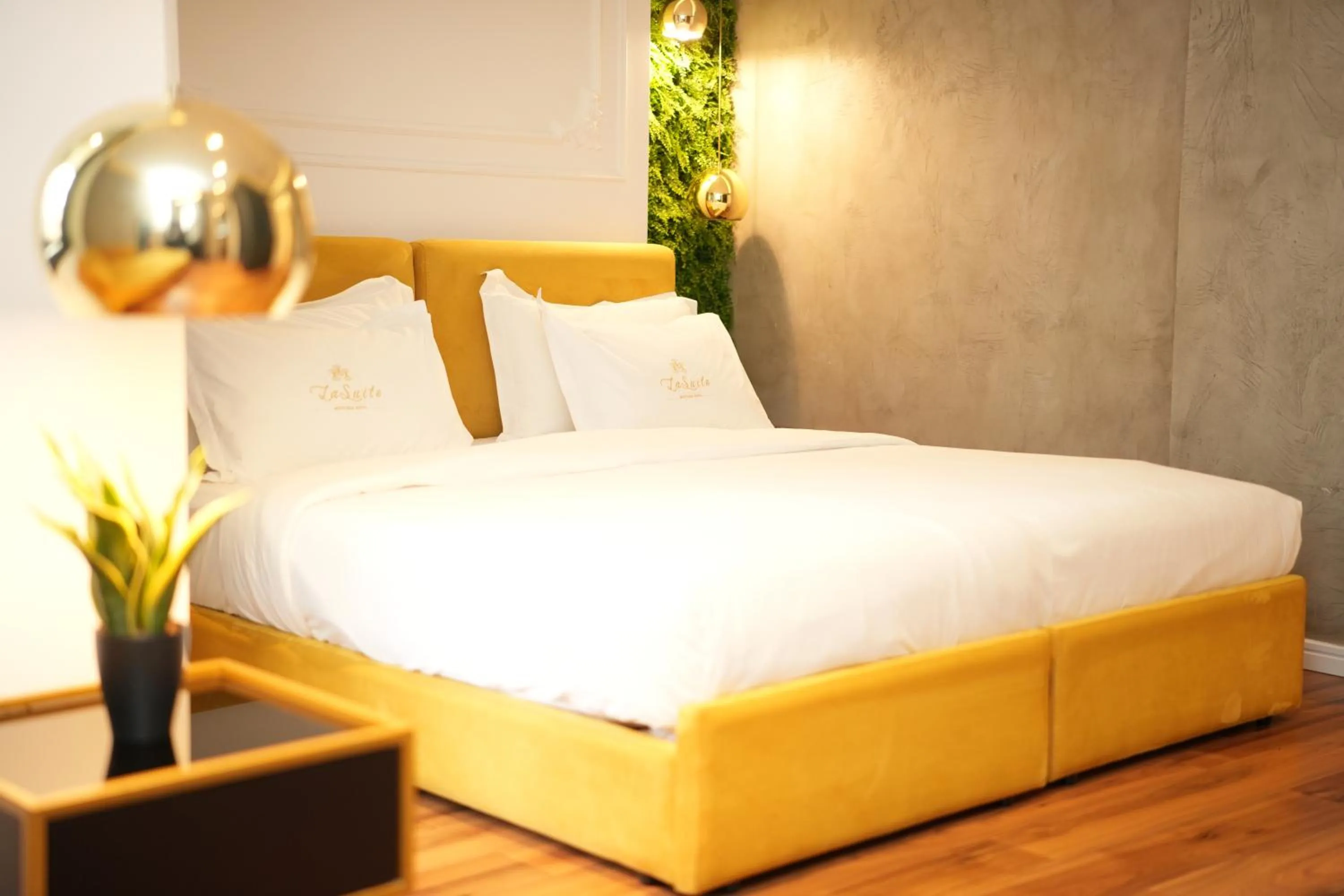 Bed in La Suite Boutique Hotel