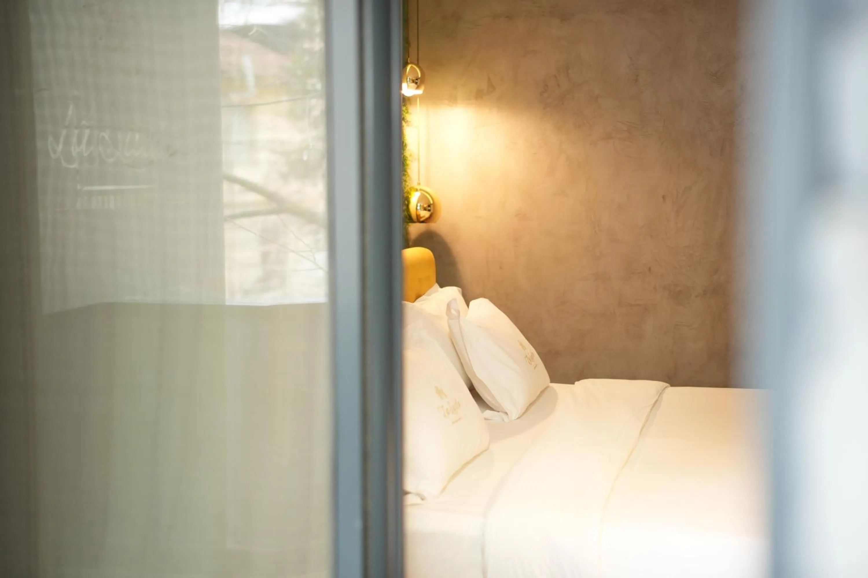 Bed in La Suite Boutique Hotel