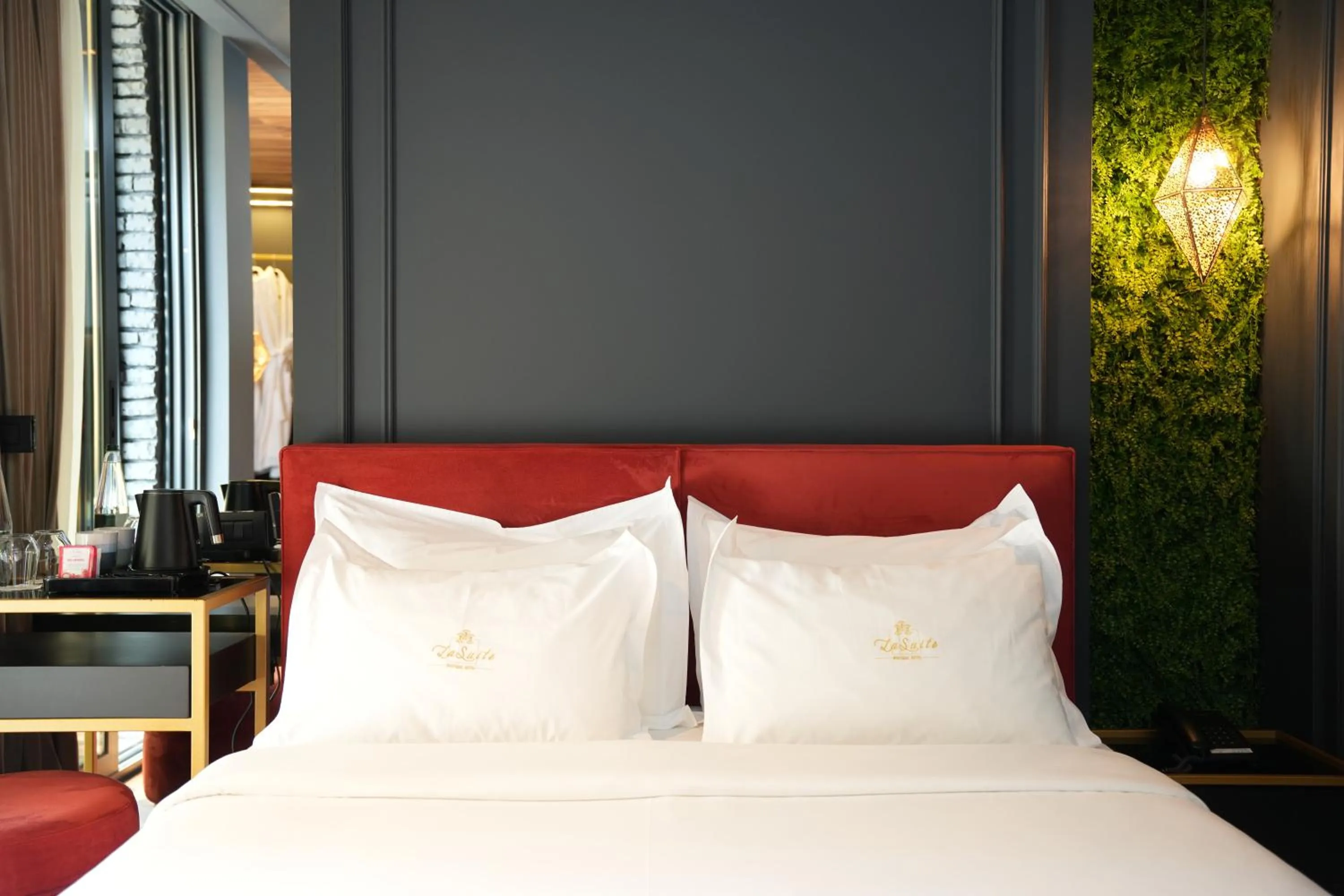 Bed in La Suite Boutique Hotel