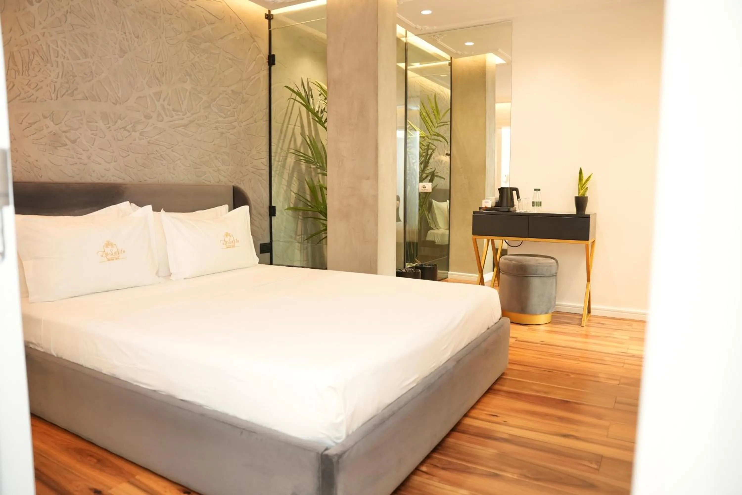 Bed in La Suite Boutique Hotel