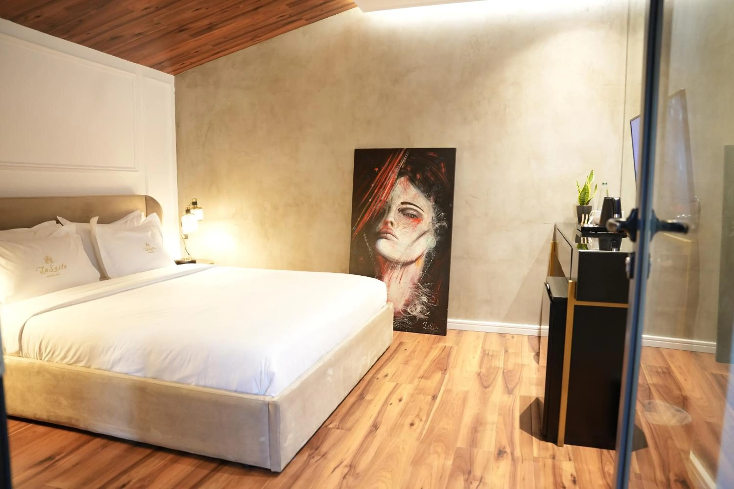 Bed in La Suite Boutique Hotel