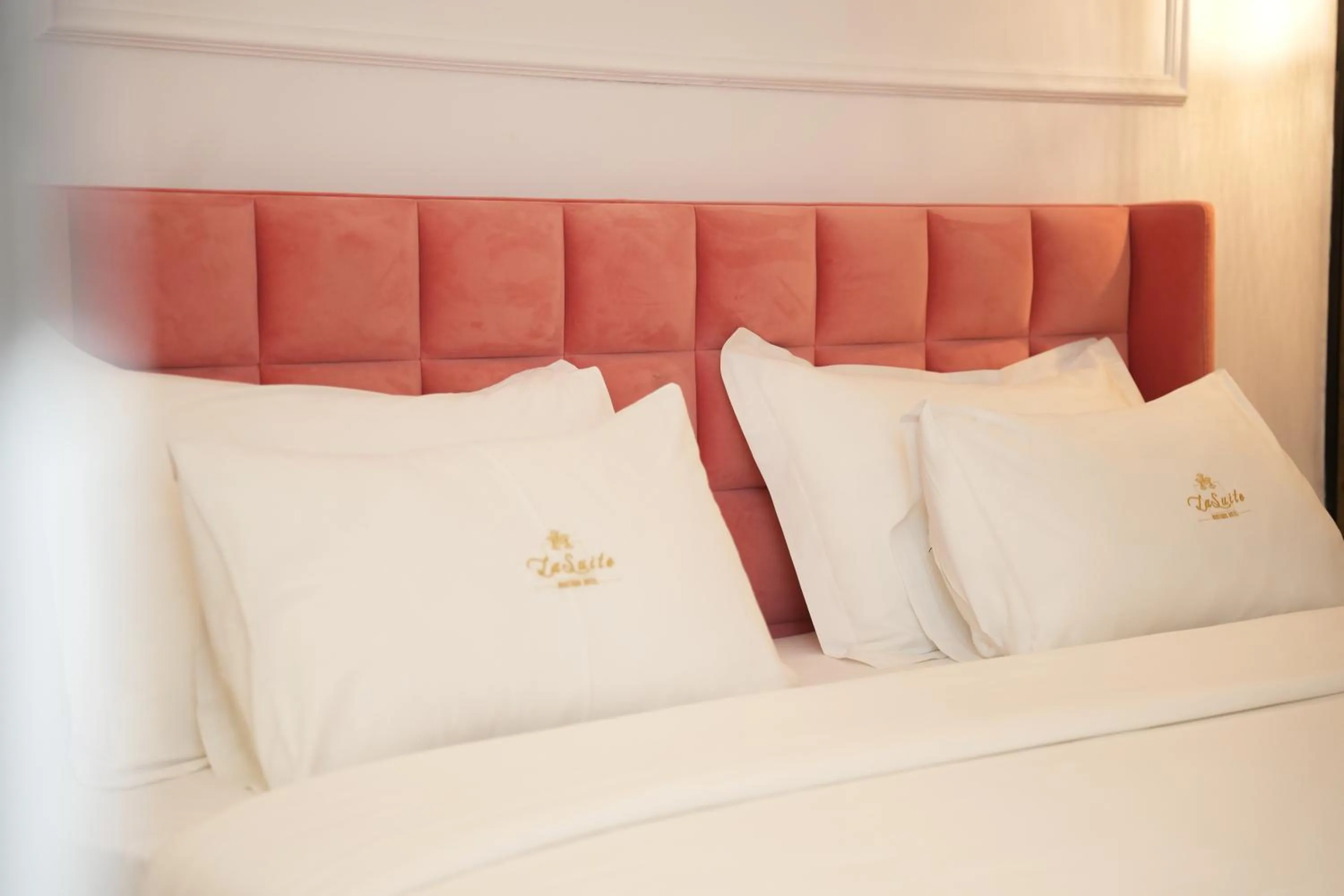 Bed in La Suite Boutique Hotel