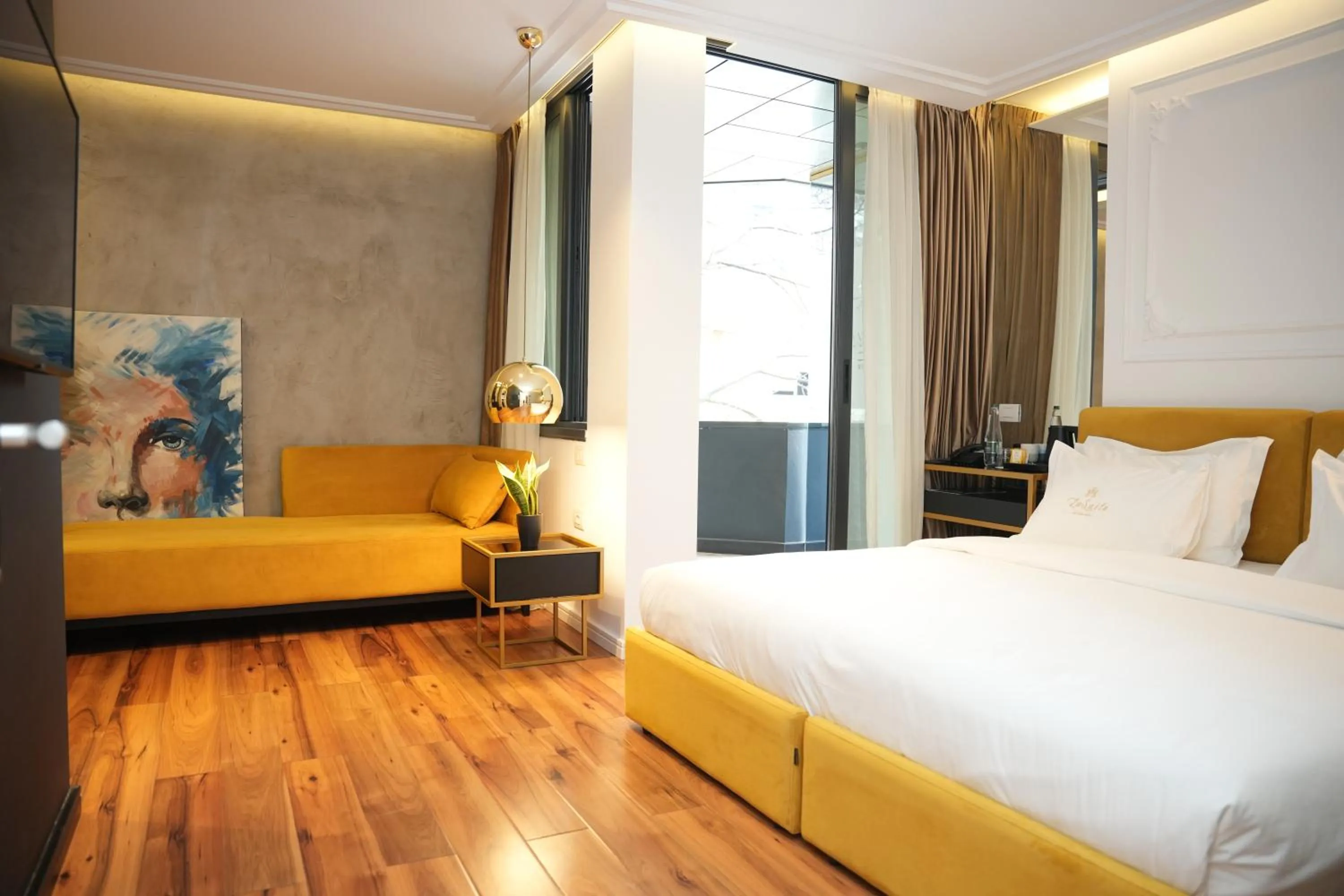 Bed in La Suite Boutique Hotel