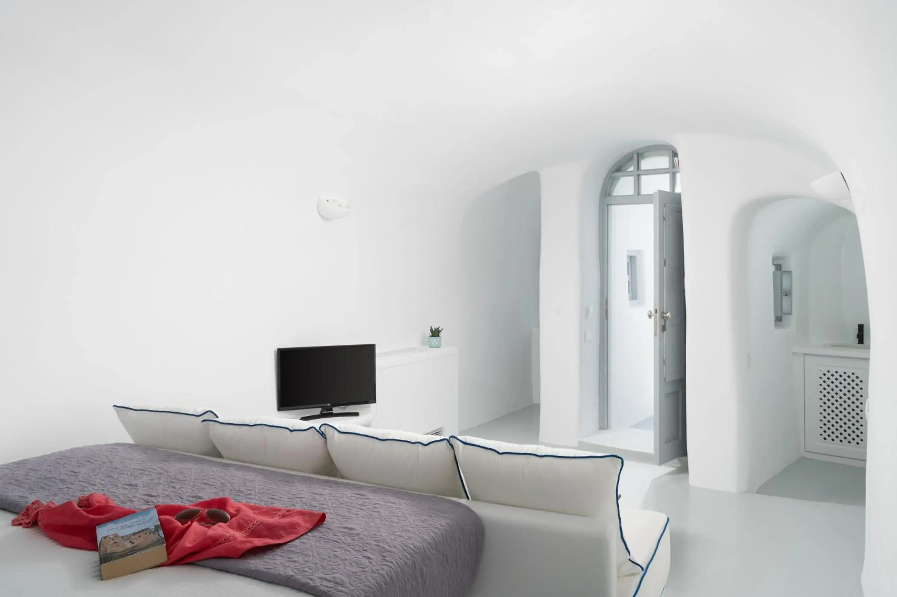 Seating area, Bed in Oia Spirit Studios by Mary D Nomikou Seating area, Bed in Oia Spirit Studios by Mary D Nomikou