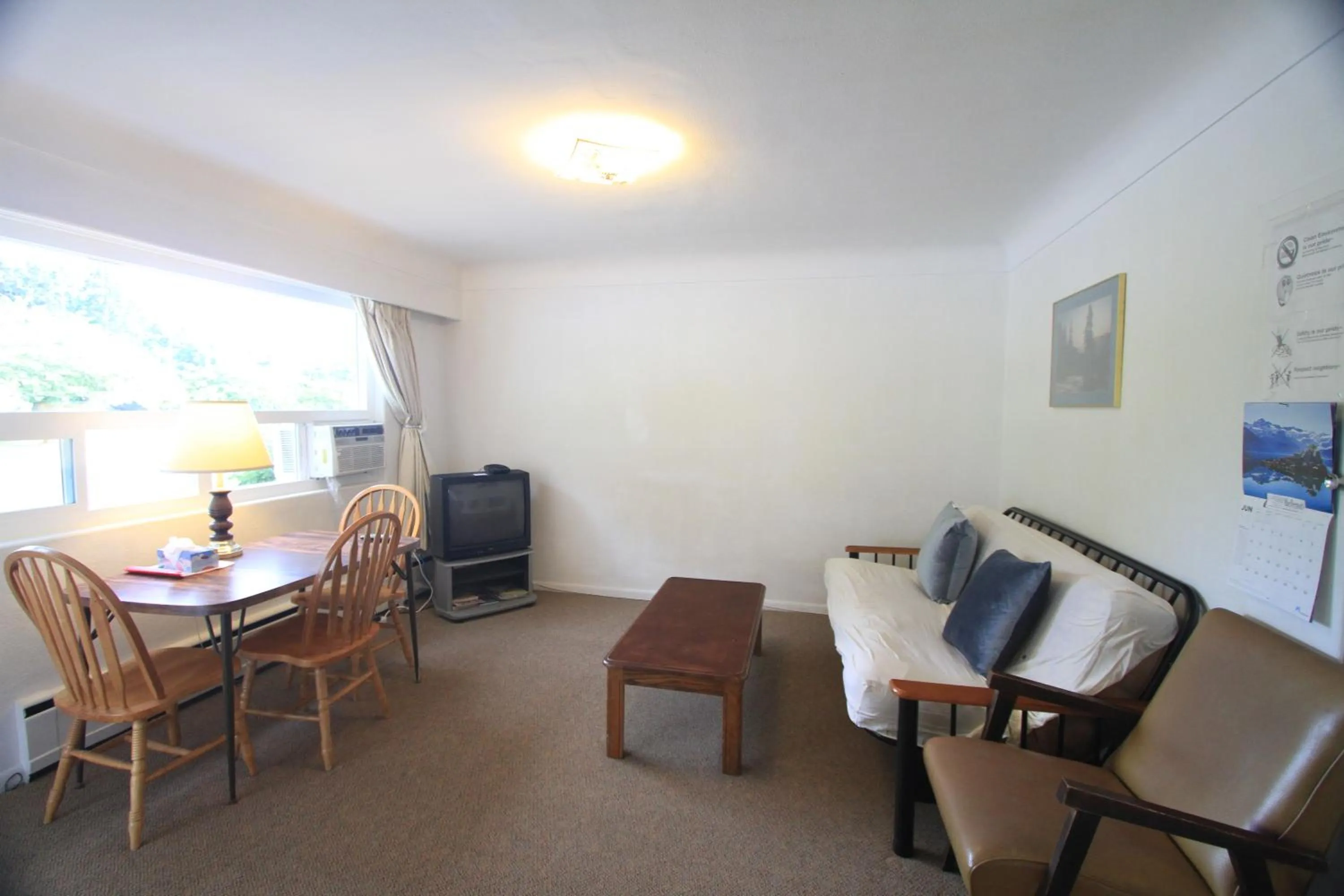 Living room in Sunset Motel & Trailer Park, Incorporated