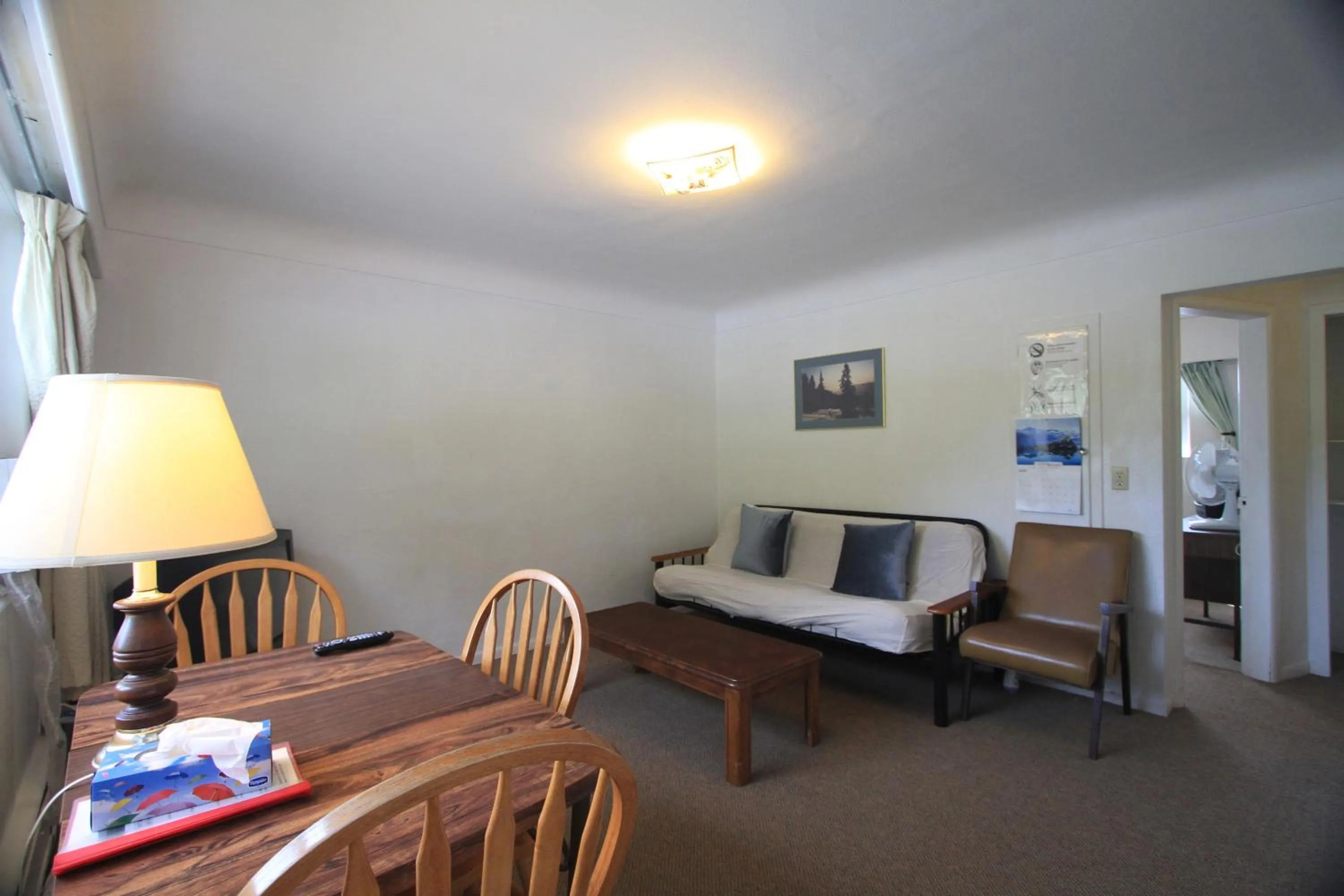 Living room in Sunset Motel & Trailer Park, Incorporated