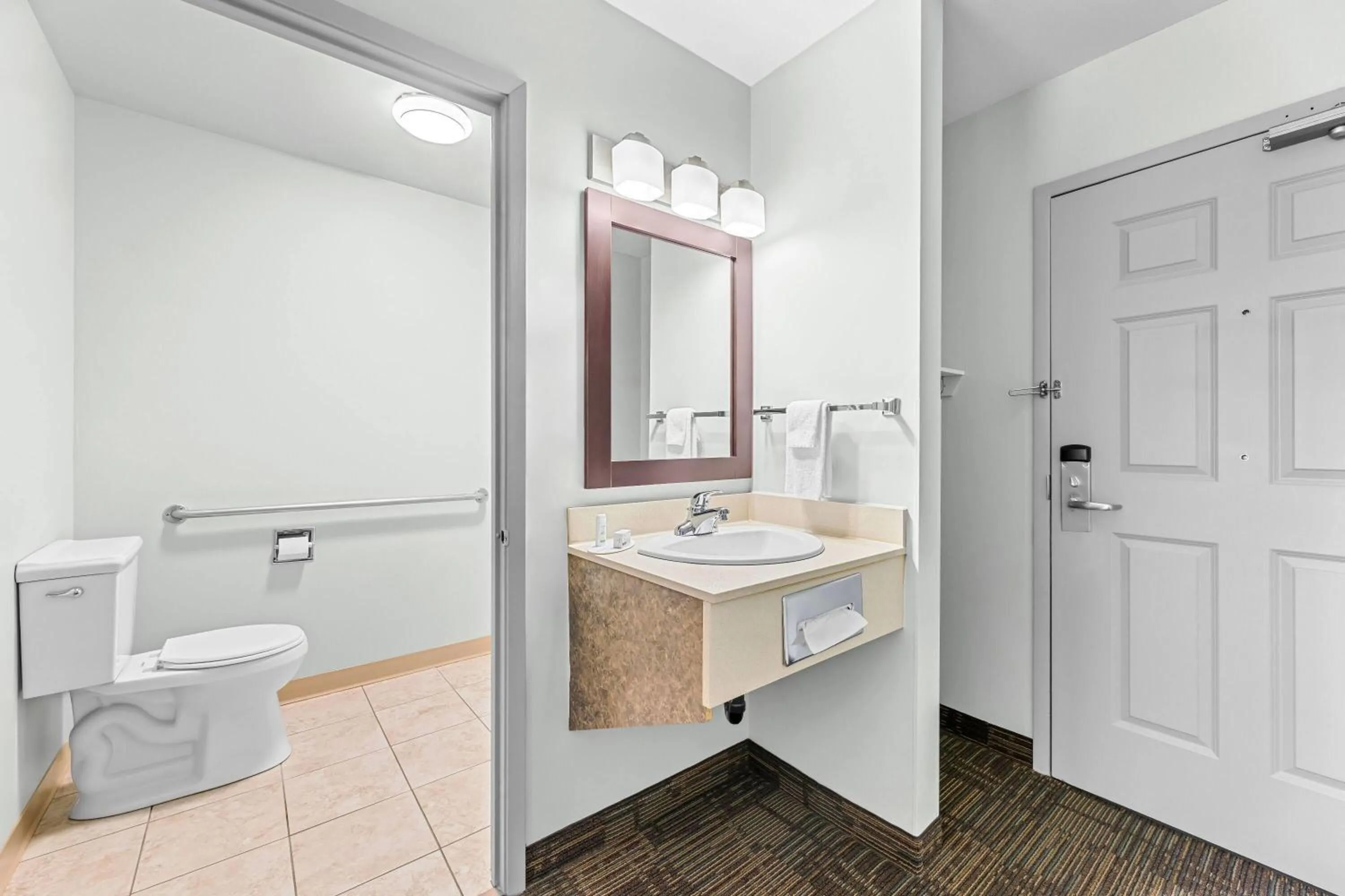 Bathroom in Super 8 by Wyndham Saskatoon Near Saskatoon Airport