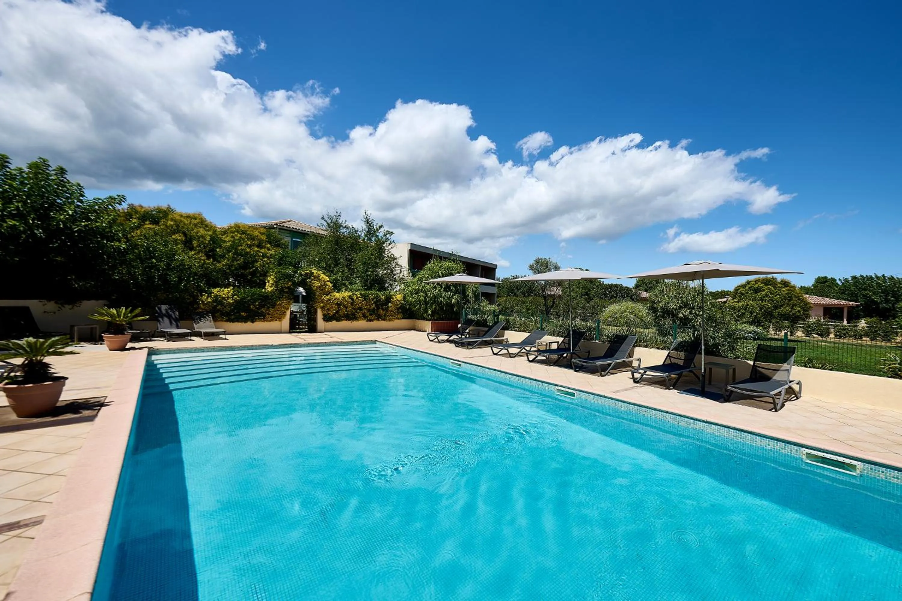 Garden view in Hôtel Les Jardins
