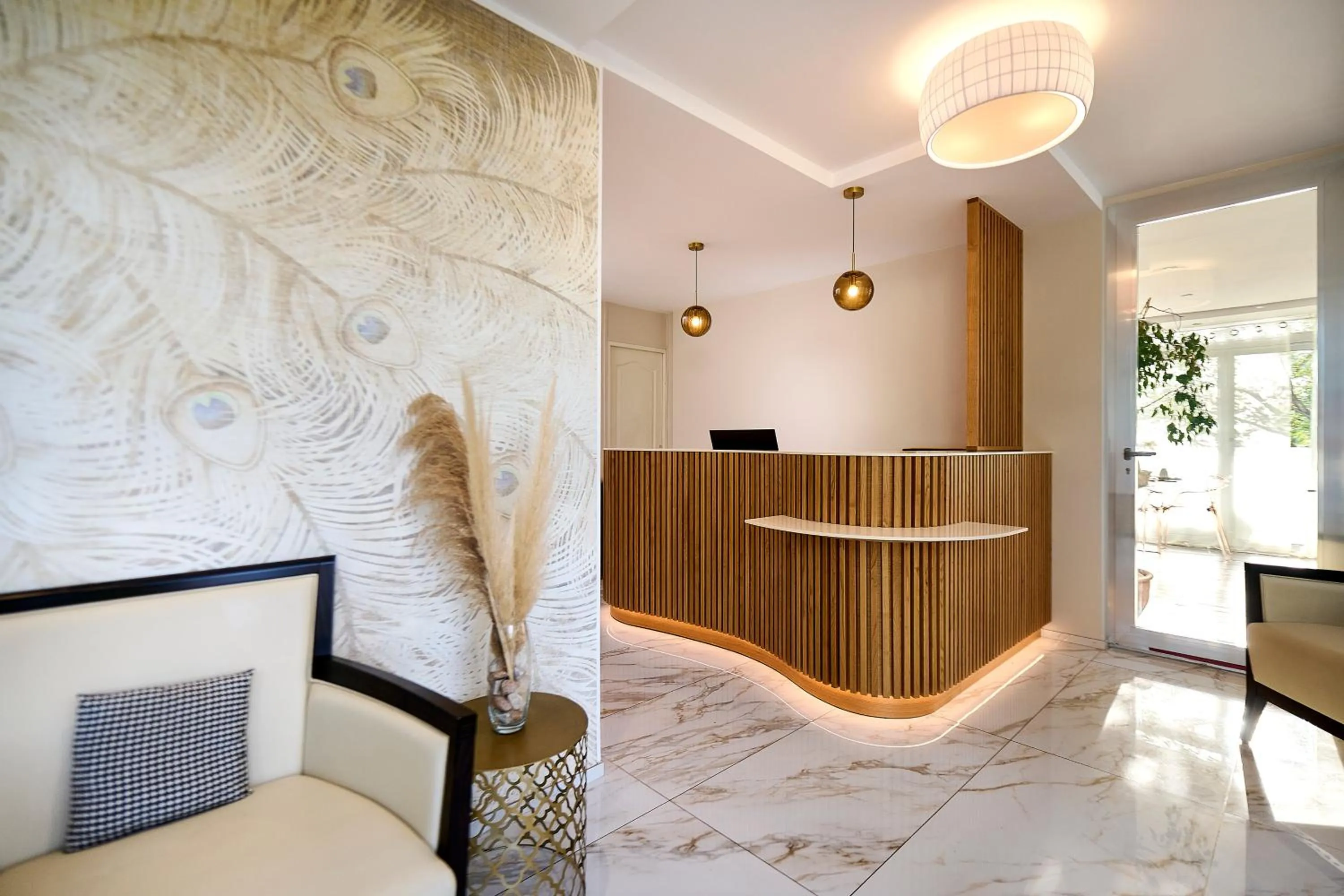 Lobby or reception in Hôtel Les Jardins