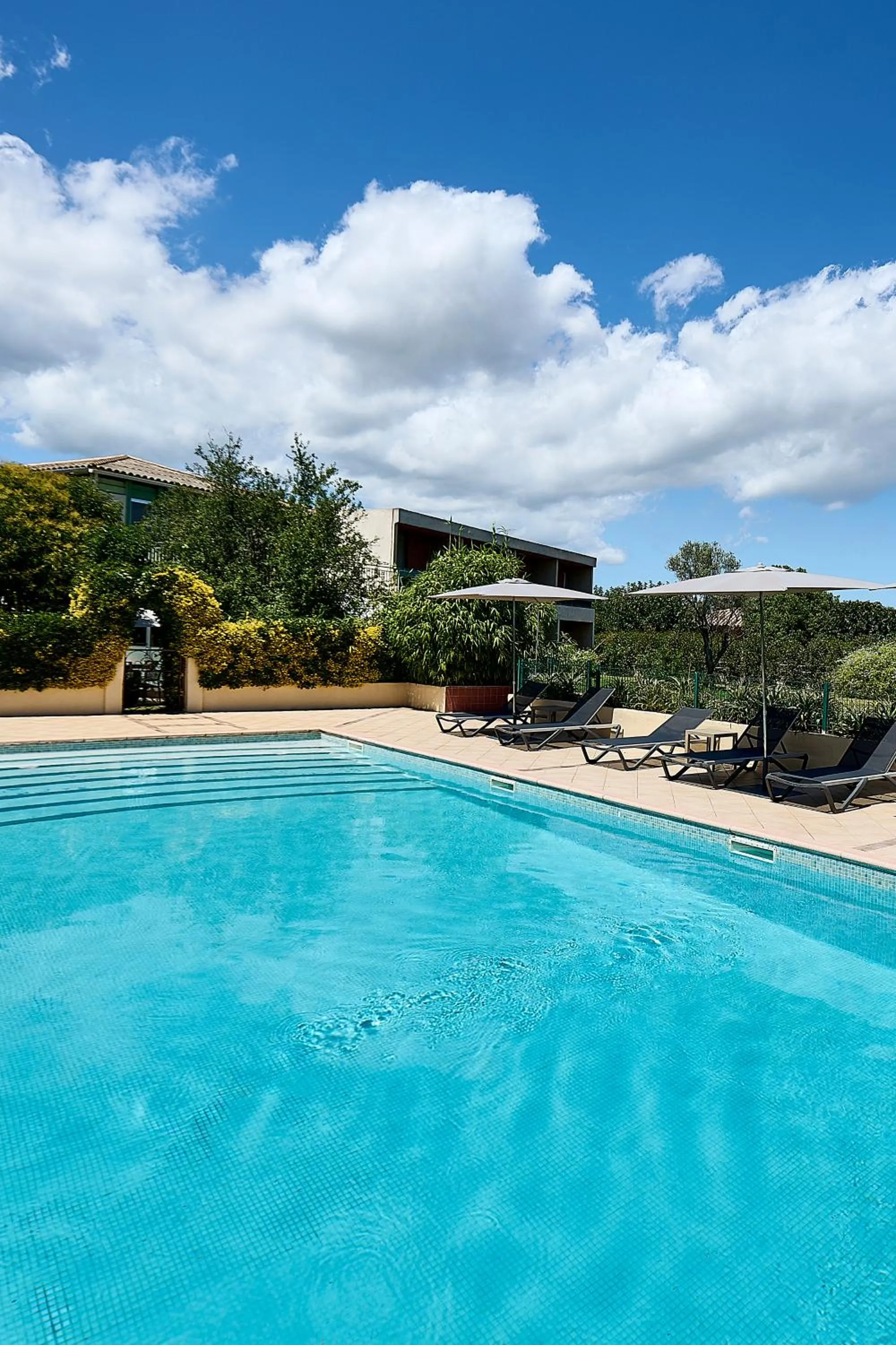 Swimming pool in Hôtel Les Jardins
