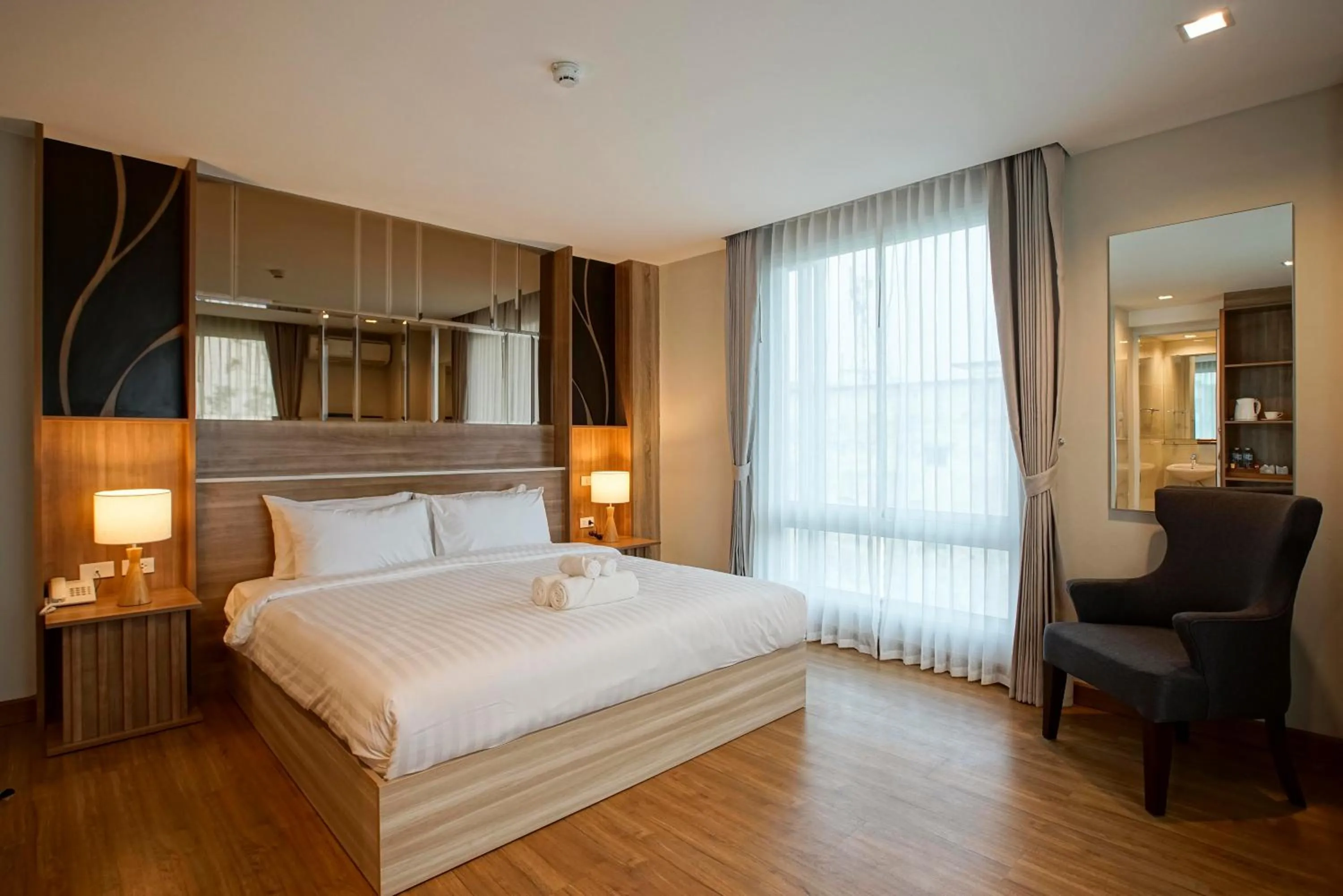 Photo of the whole room, Bed in Nantra Chiangmai Riverfront Hotel