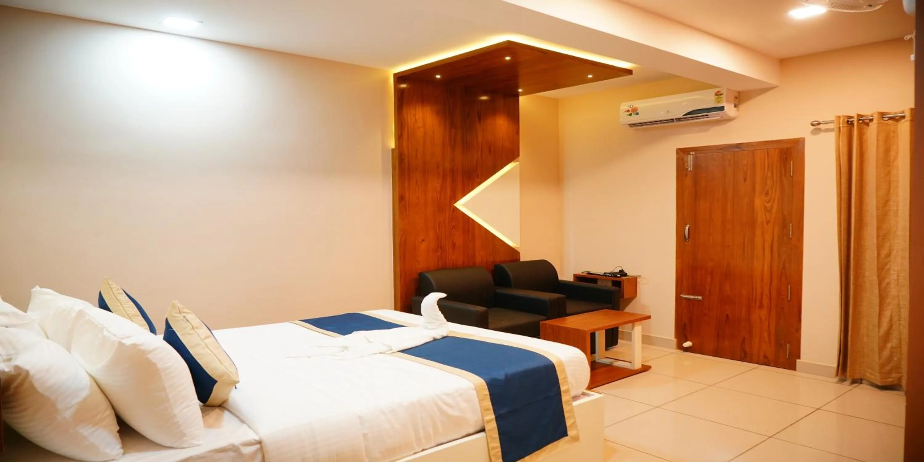 Bed in Nextel Inn, Calicut