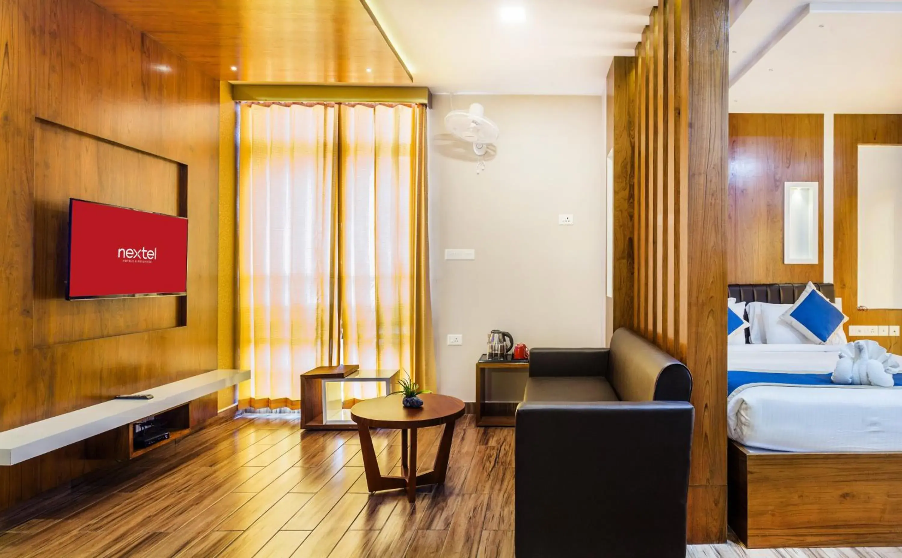 Living room, Bed in Nextel Inn, Calicut Living room, Bed in Nextel Inn, Calicut