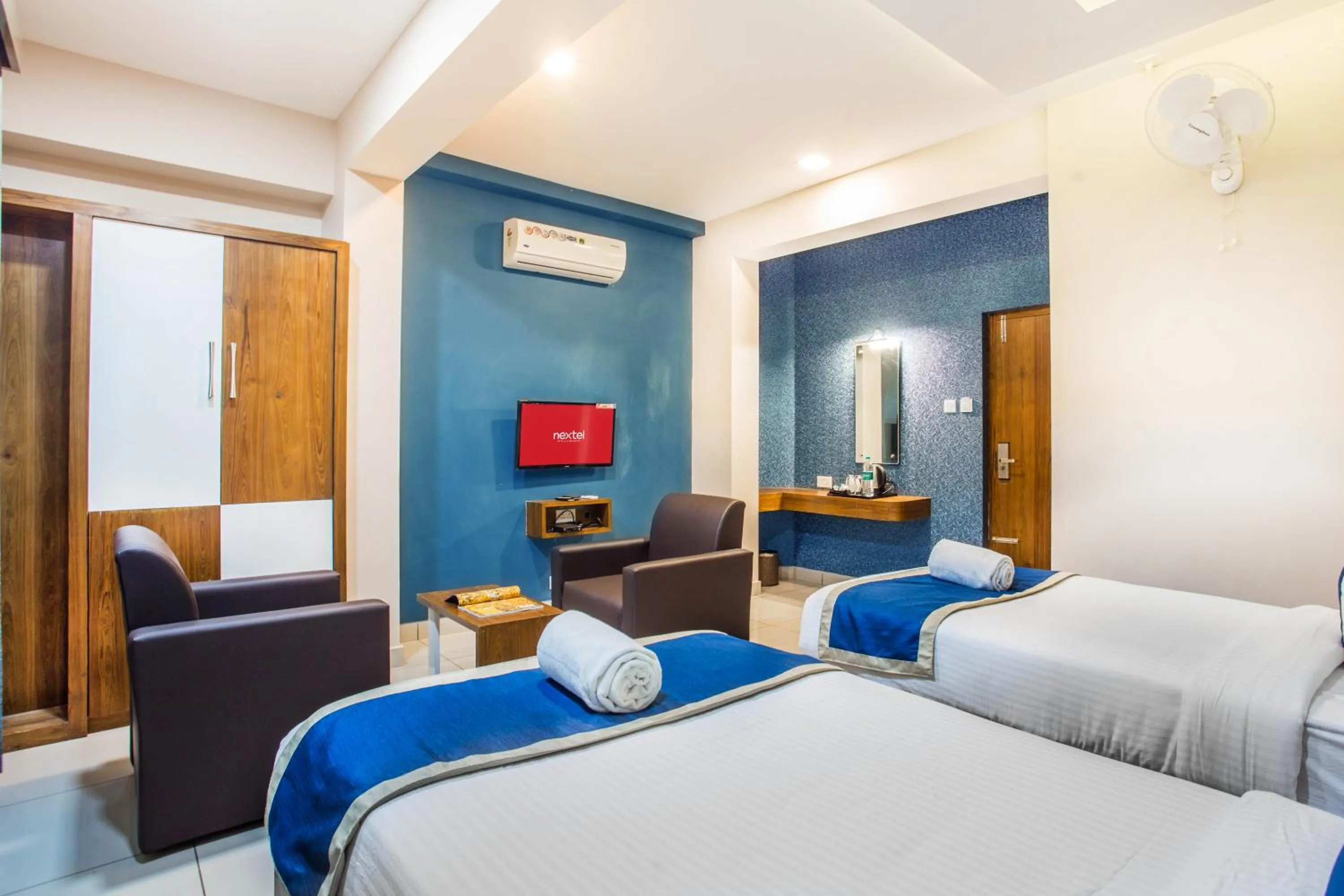 Photo of the whole room, Bed in Nextel Inn, Calicut