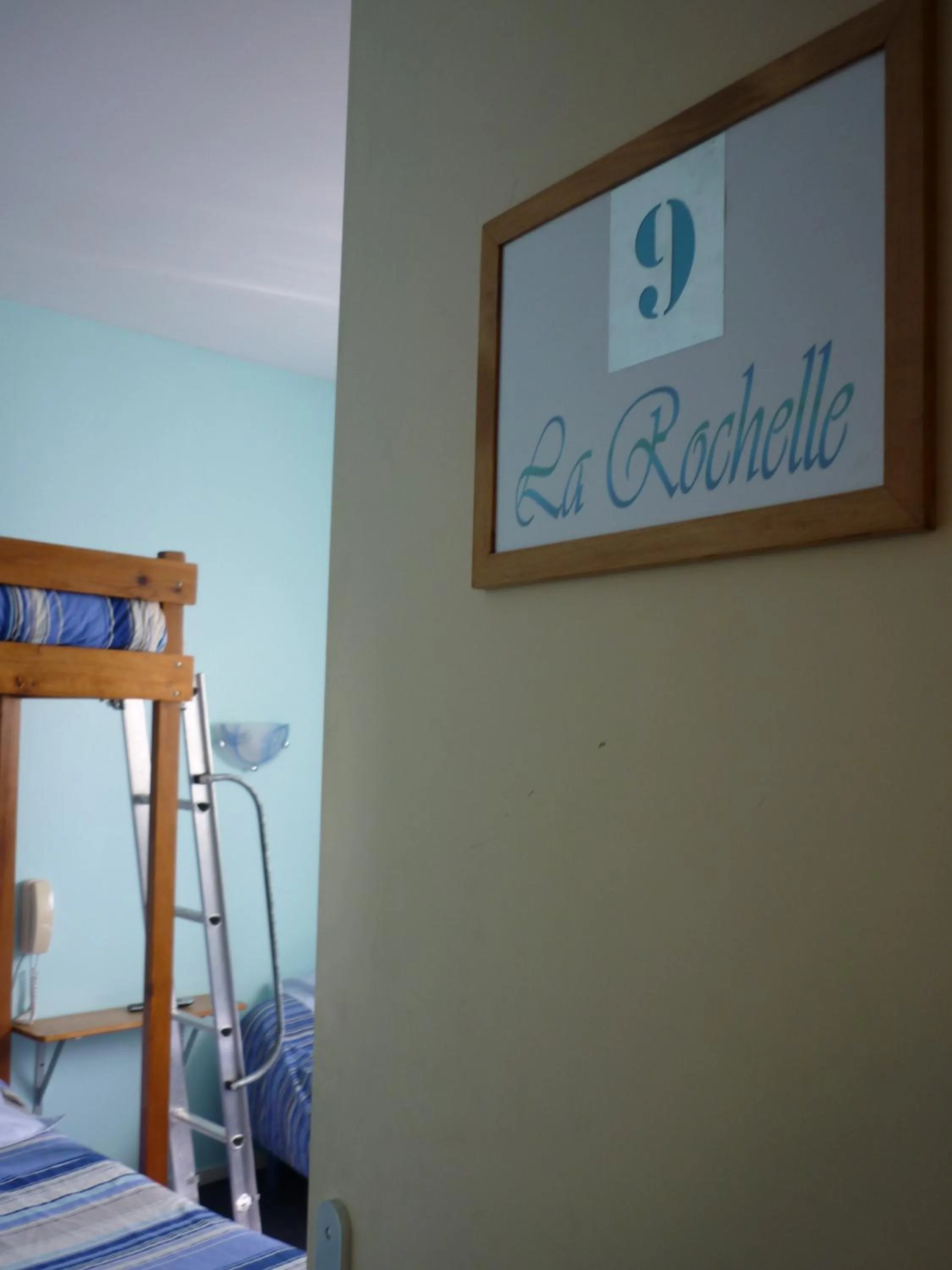 Photo of the whole room, Bed in Hôtel du Centre