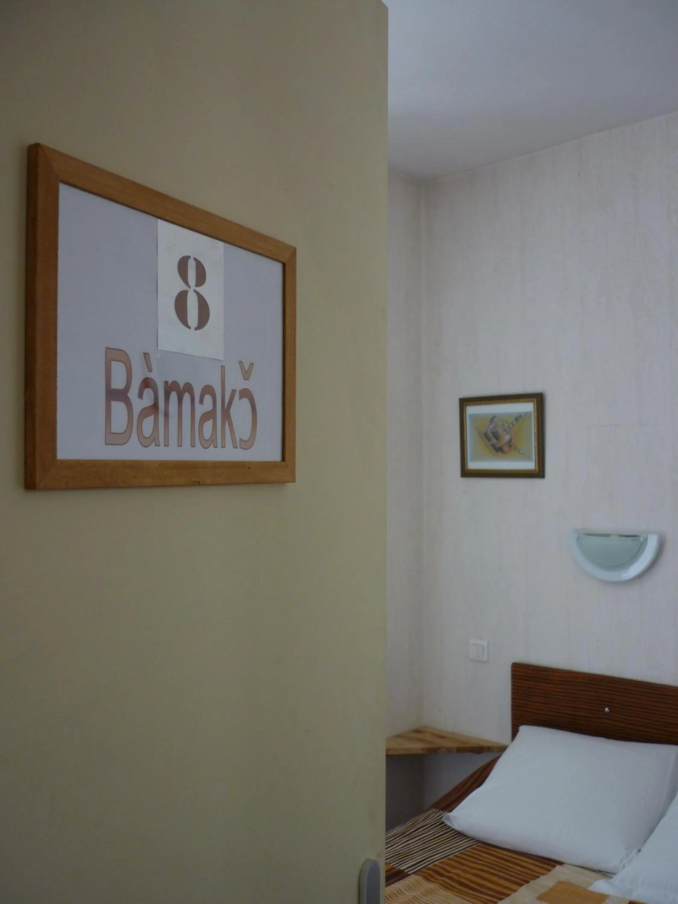 Photo of the whole room, Bed in Hôtel du Centre