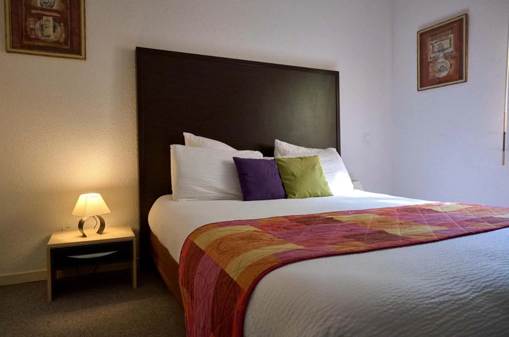 Bed in LOGIS Hôtel Le Moulin Des Gardelles