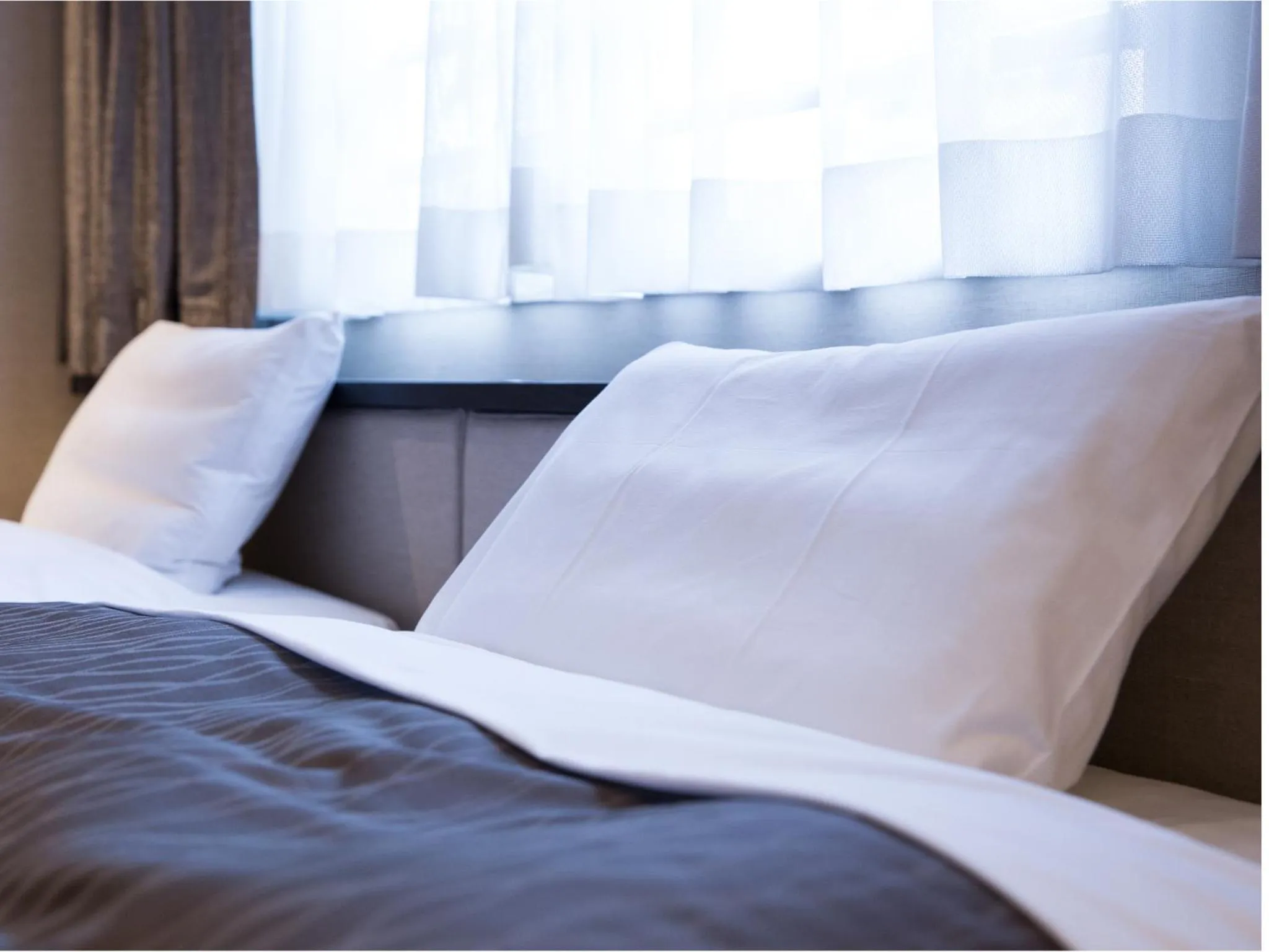 Photo of the whole room, Bed in THE HOTELS HAKATA KASANE Bayside