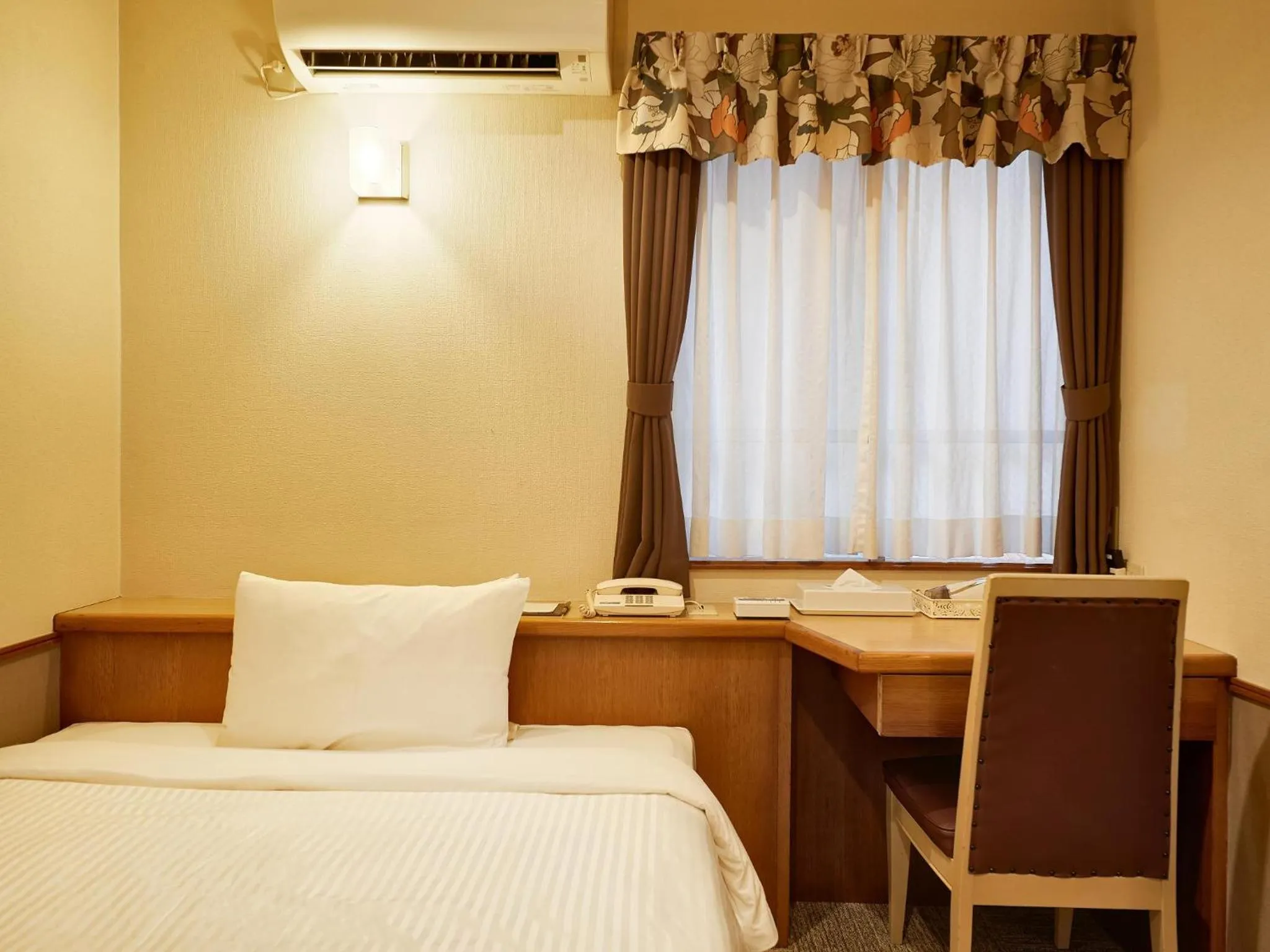 Photo of the whole room, Bed in Crown Hotel Okinawa