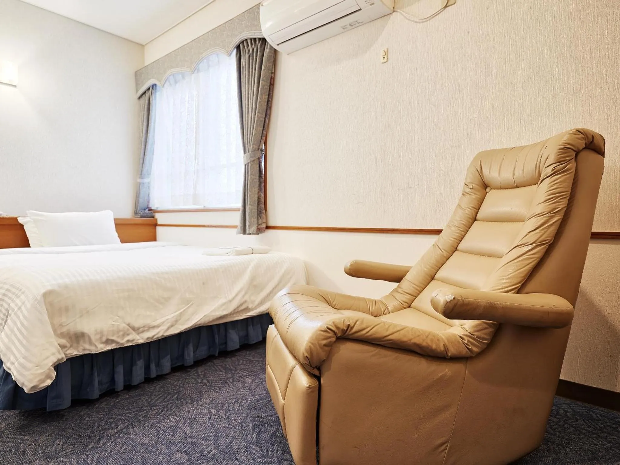 Photo of the whole room, Bed in Crown Hotel Okinawa