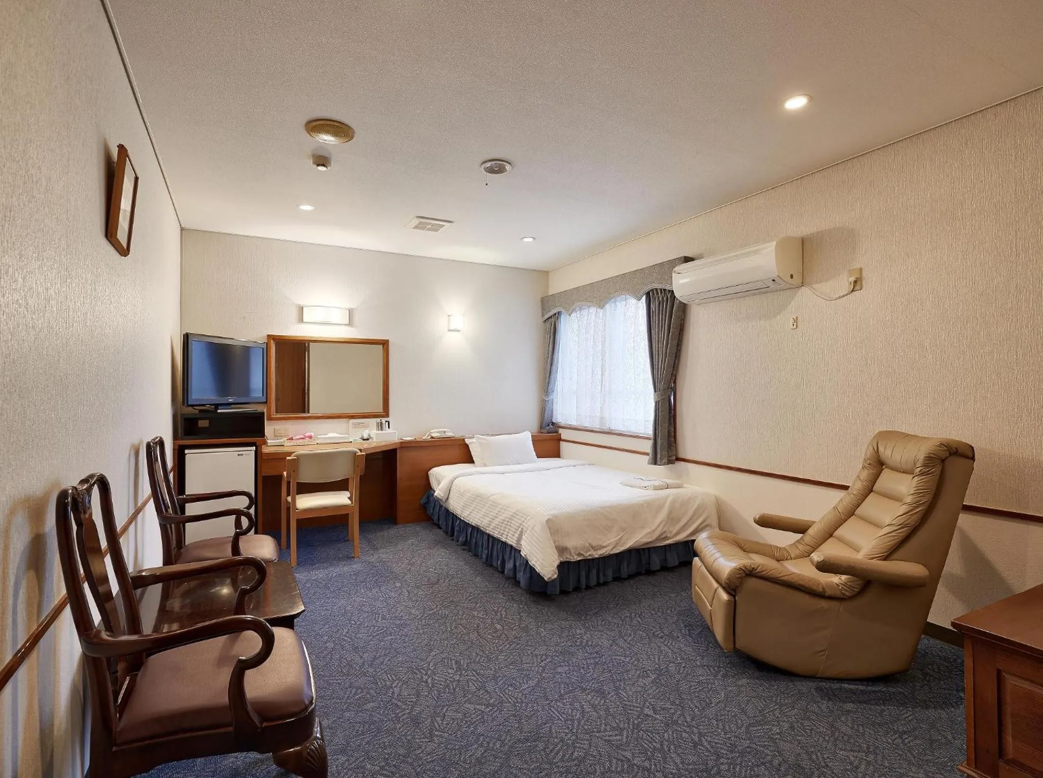 Photo of the whole room, Bed in Crown Hotel Okinawa