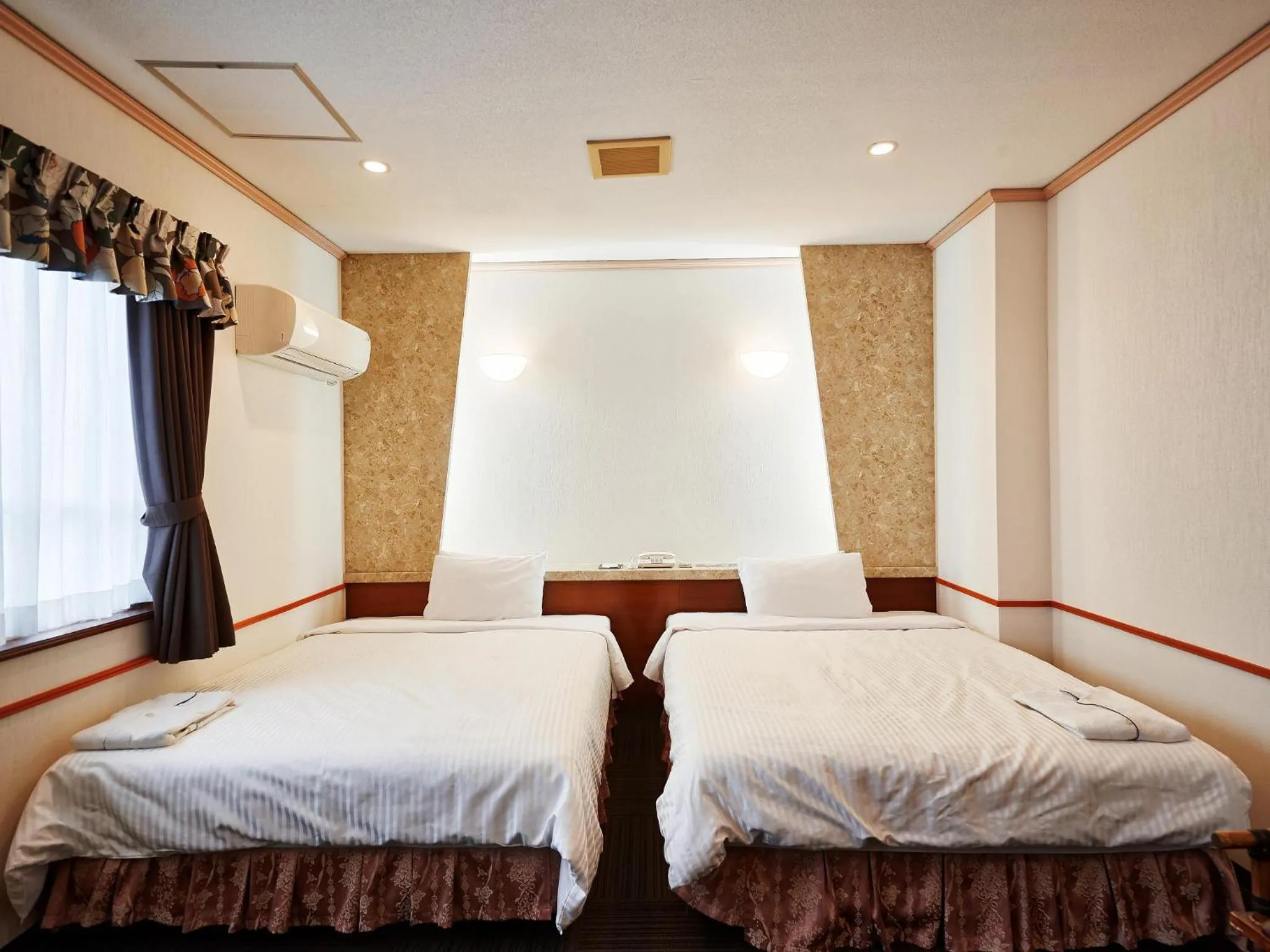Photo of the whole room, Bed in Crown Hotel Okinawa