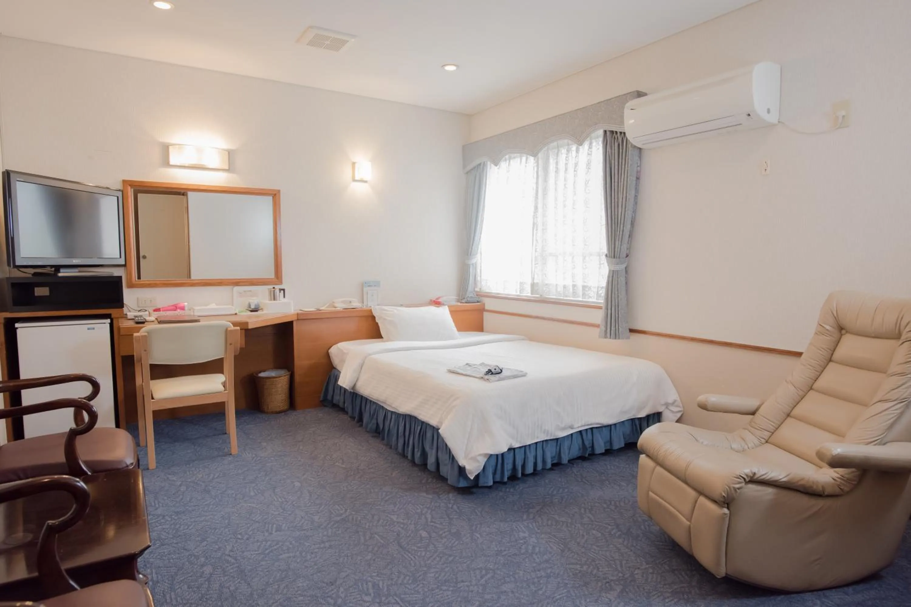 Photo of the whole room, Bed in Crown Hotel Okinawa