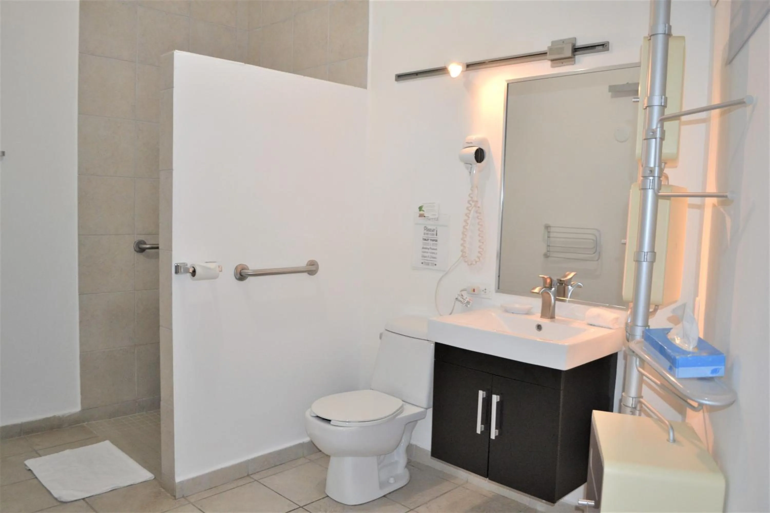 Bathroom in Casa Verde Hotel - Steps to the Beach, Pool, Restaurant & Bar