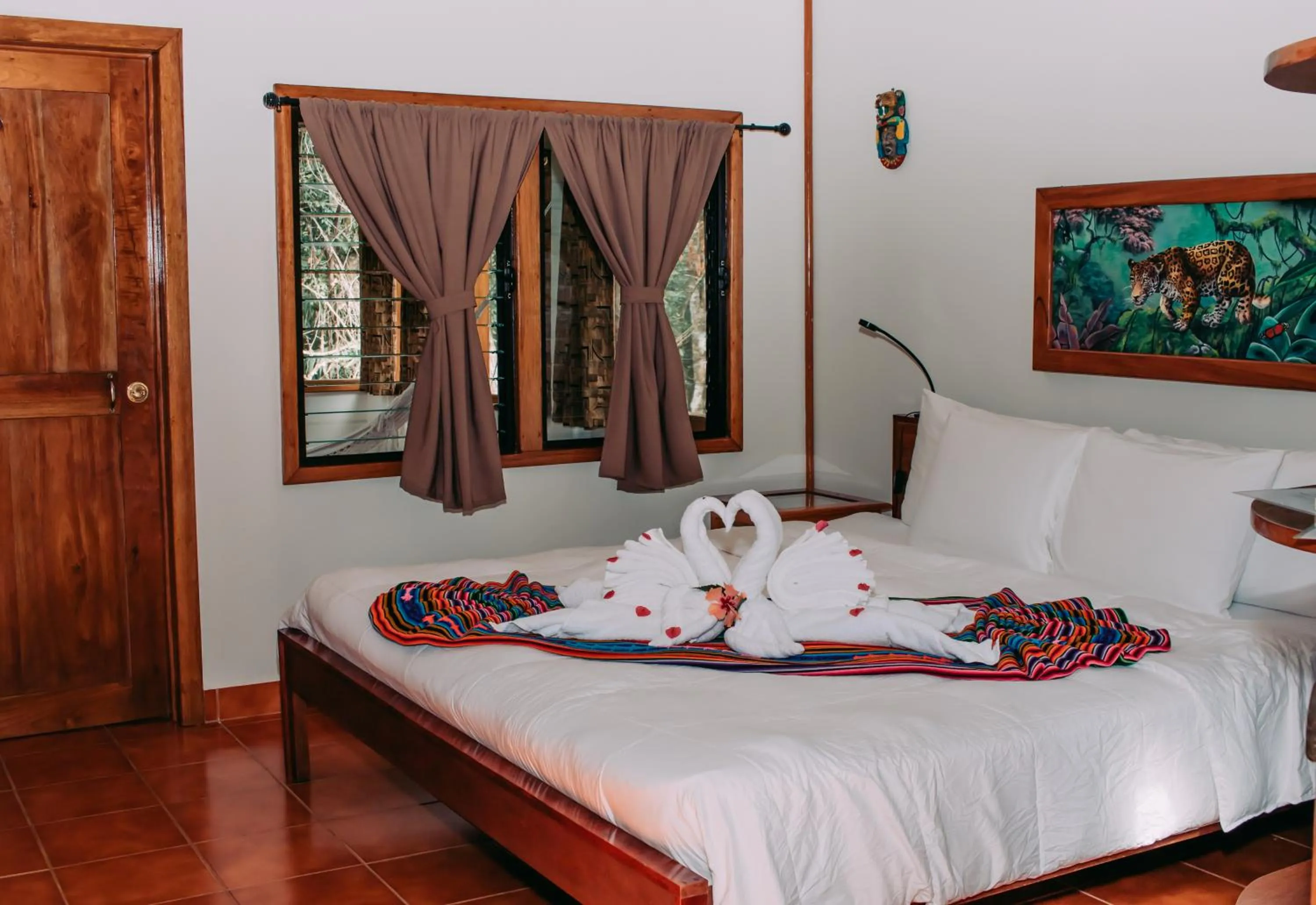 Bed in Mariposa Jungle Lodge