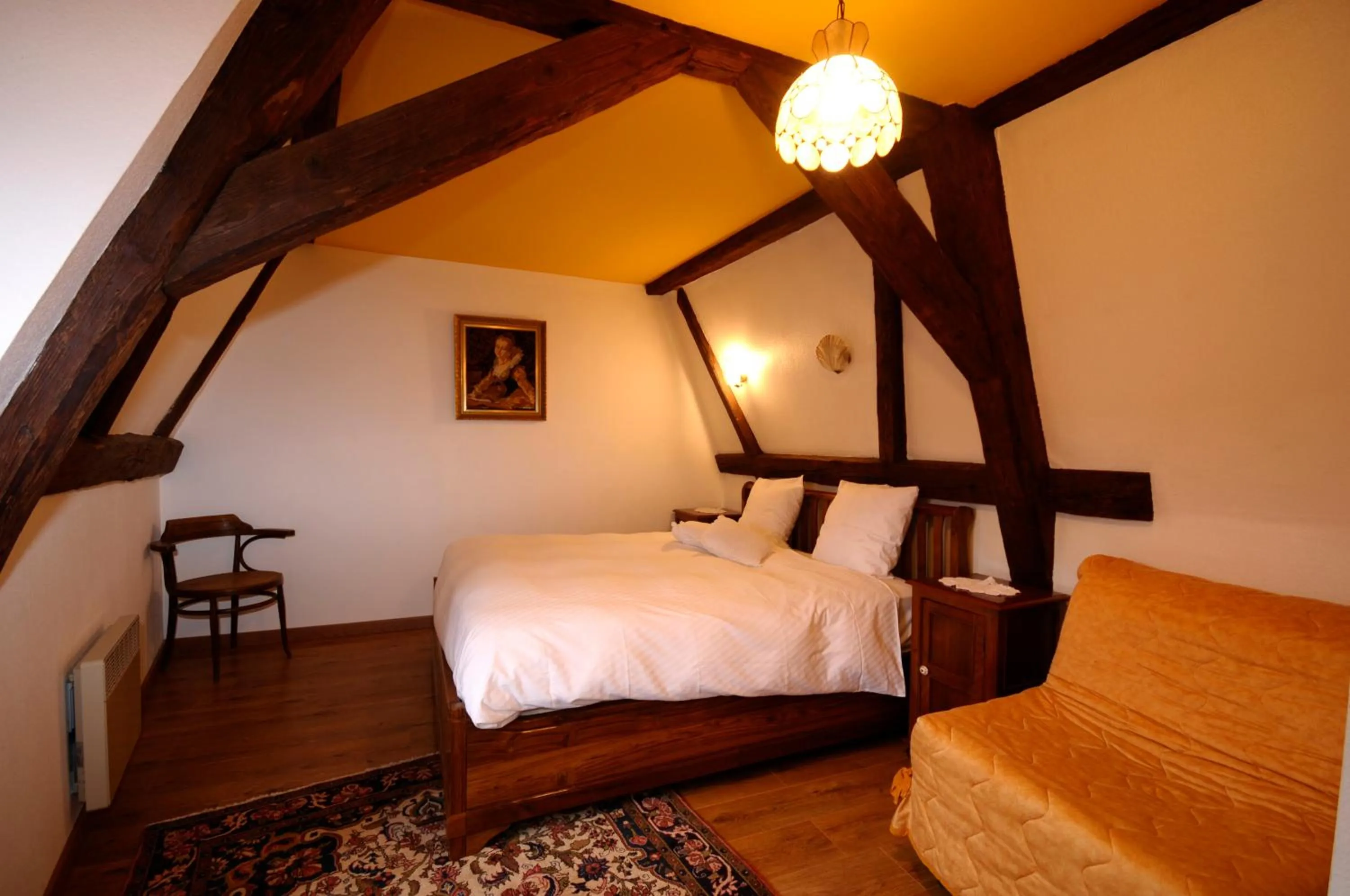 Bed in La Cour du Bailli Suites & Spa