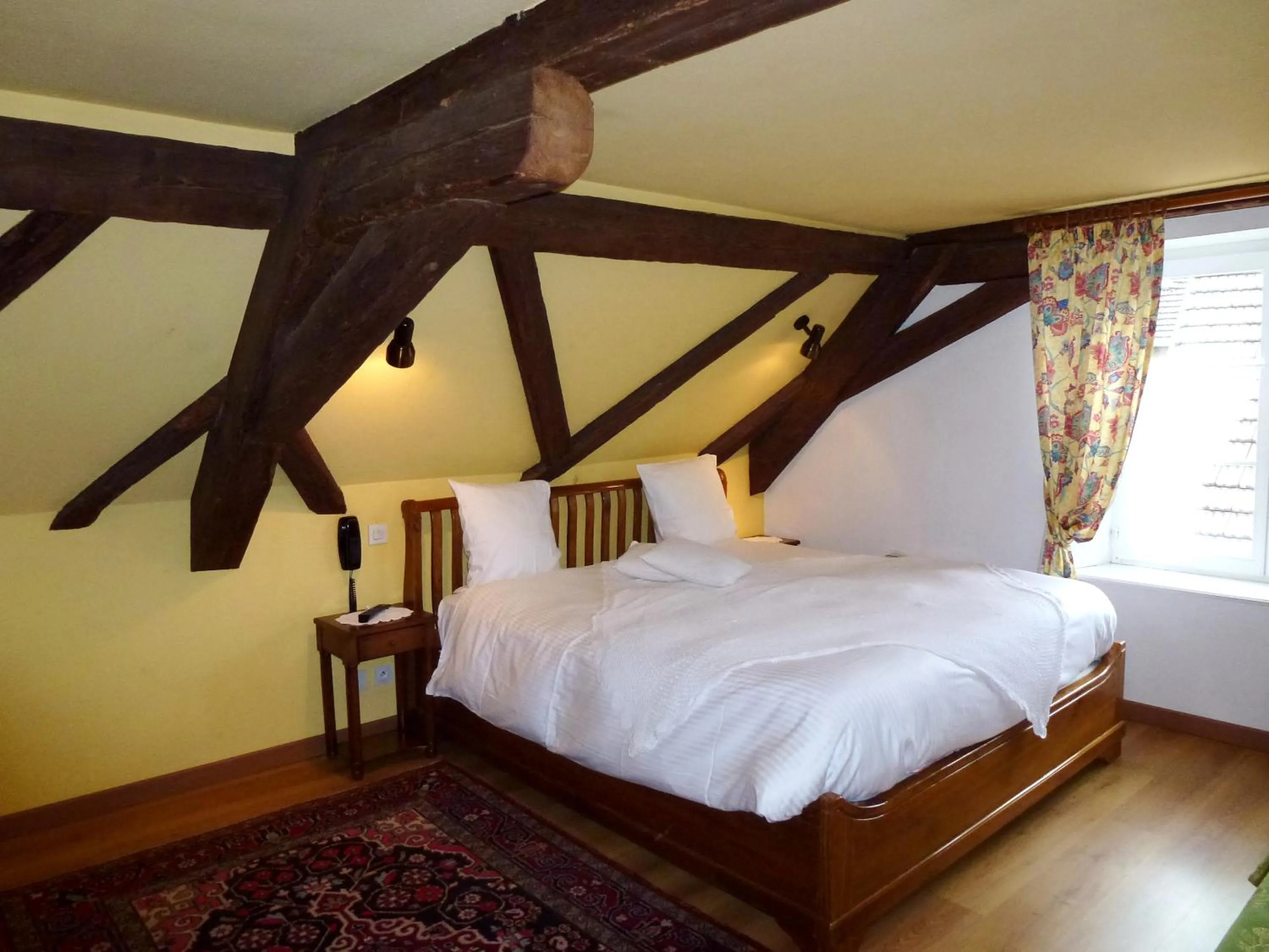 Bed in La Cour du Bailli Suites & Spa