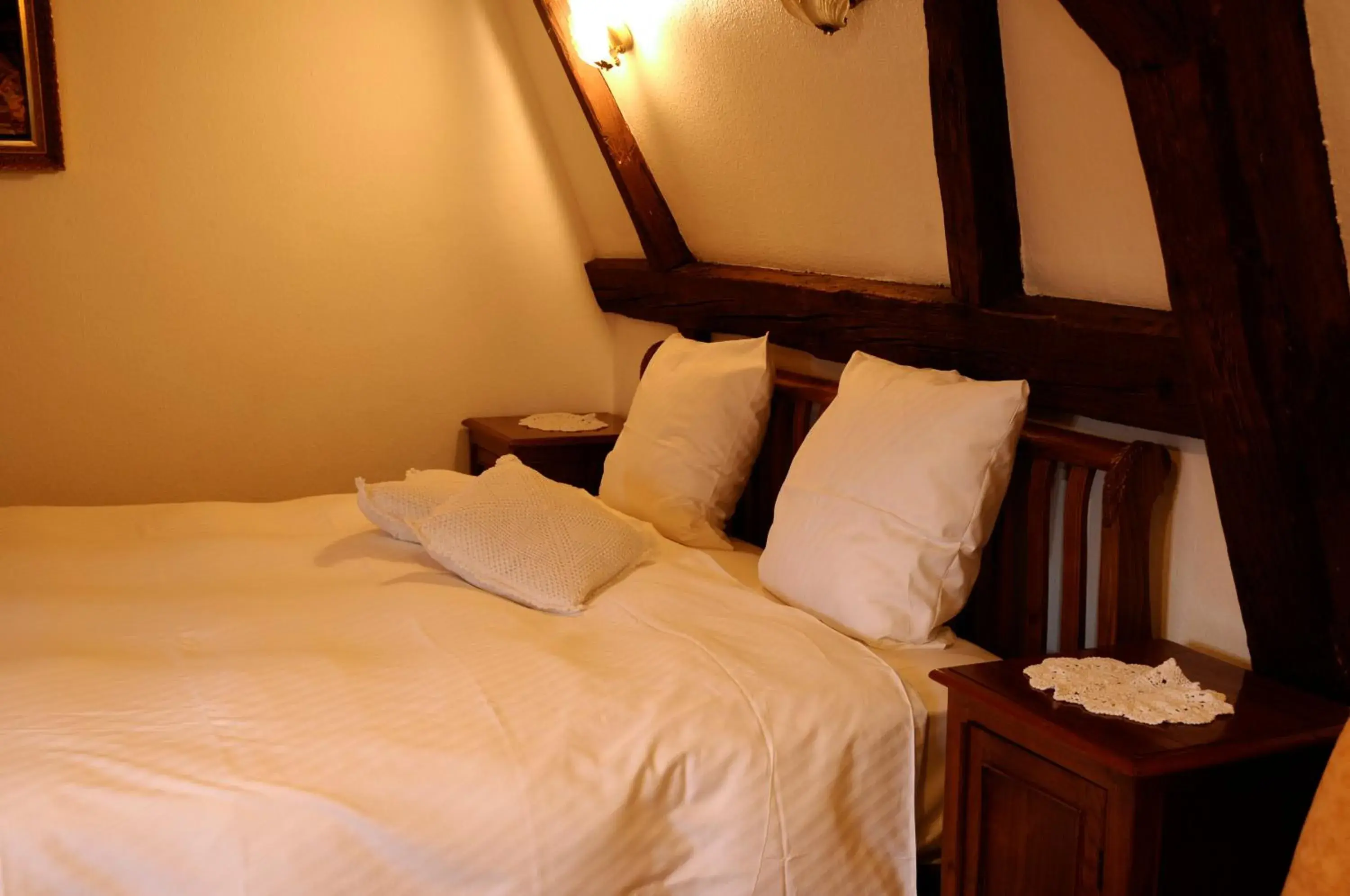 Bed in La Cour du Bailli Suites & Spa