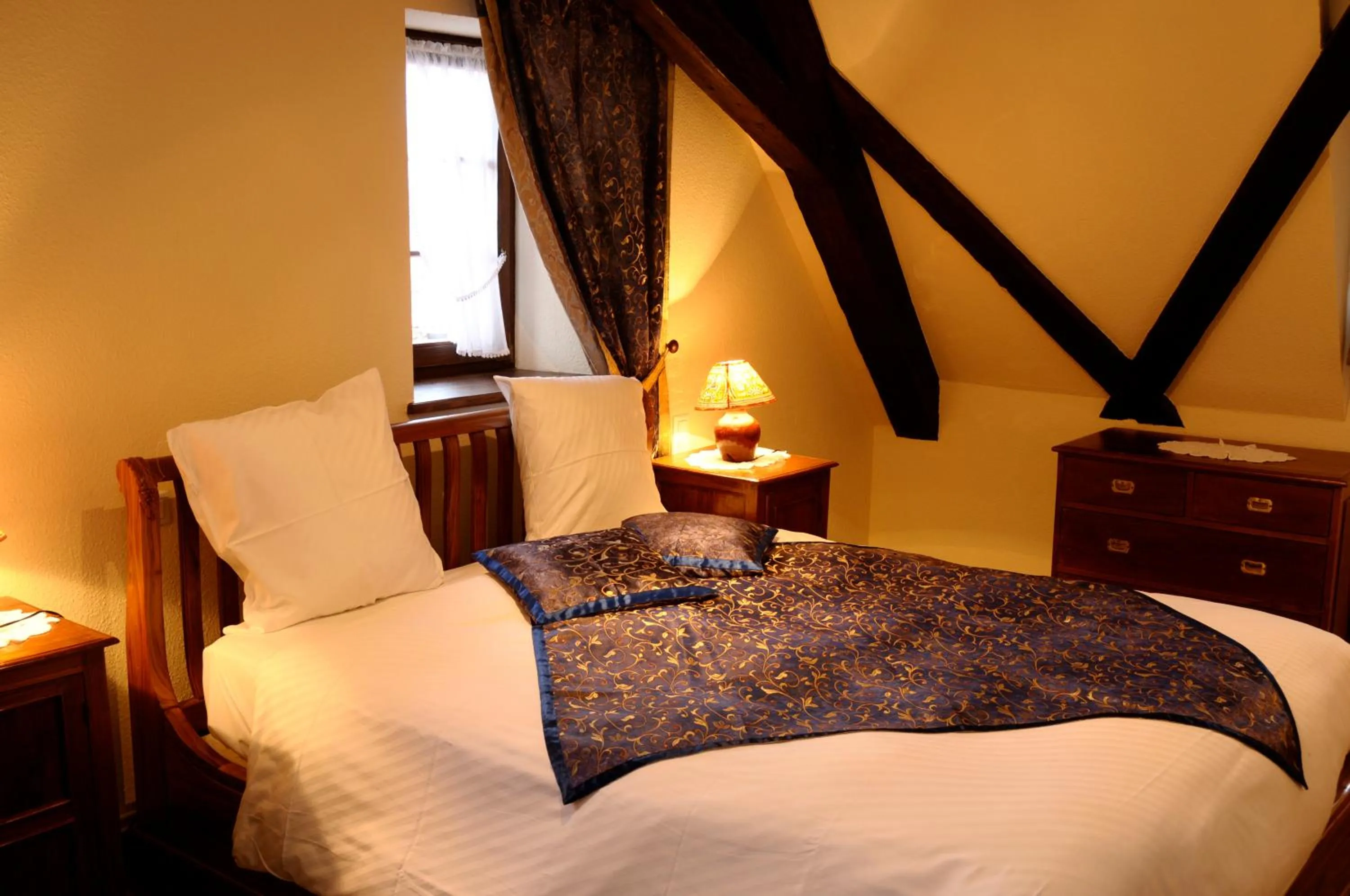 Bed in La Cour du Bailli Suites & Spa