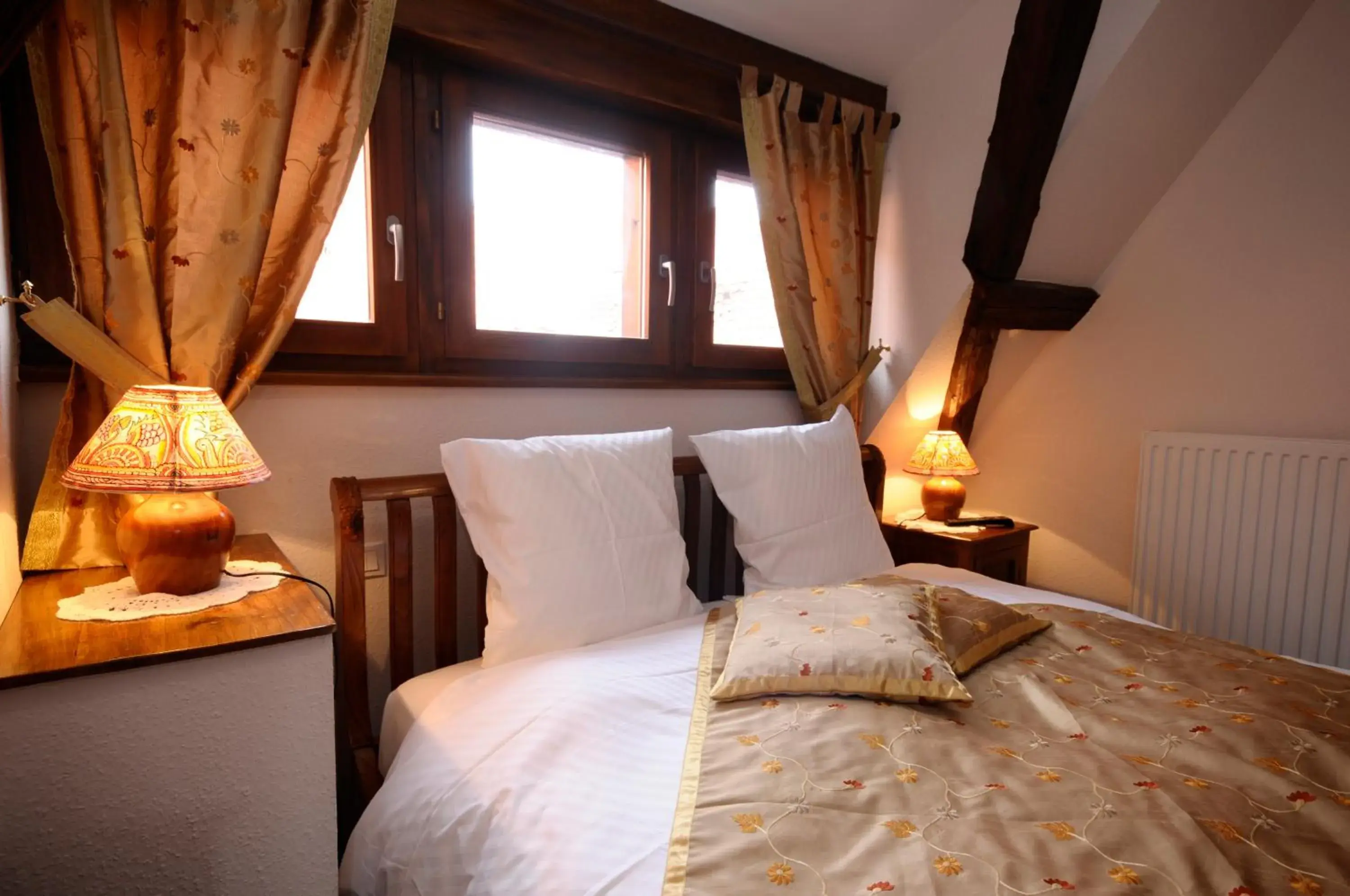 Bed in La Cour du Bailli Suites & Spa