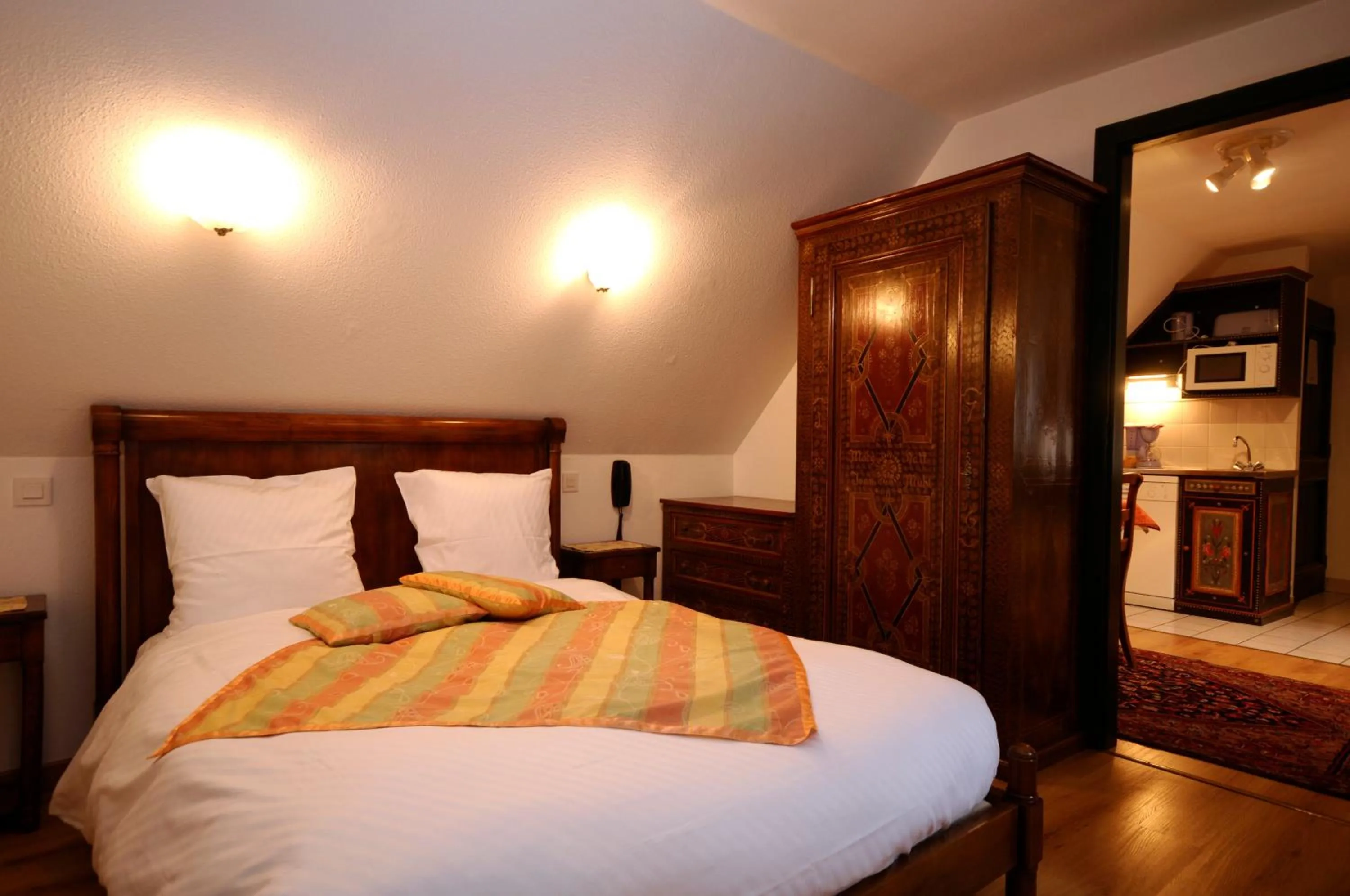 Bed in La Cour du Bailli Suites & Spa