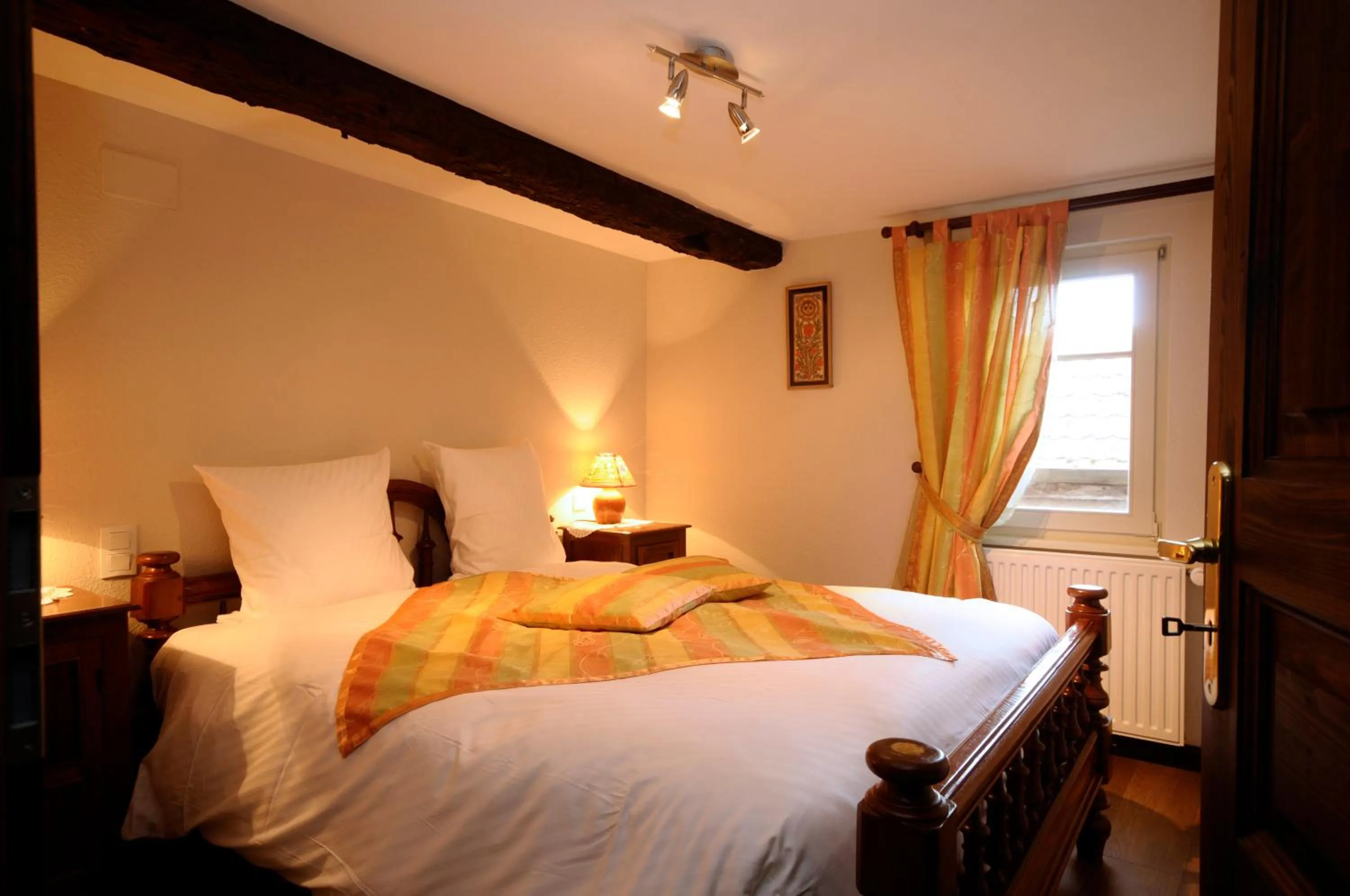 Bed in La Cour du Bailli Suites & Spa