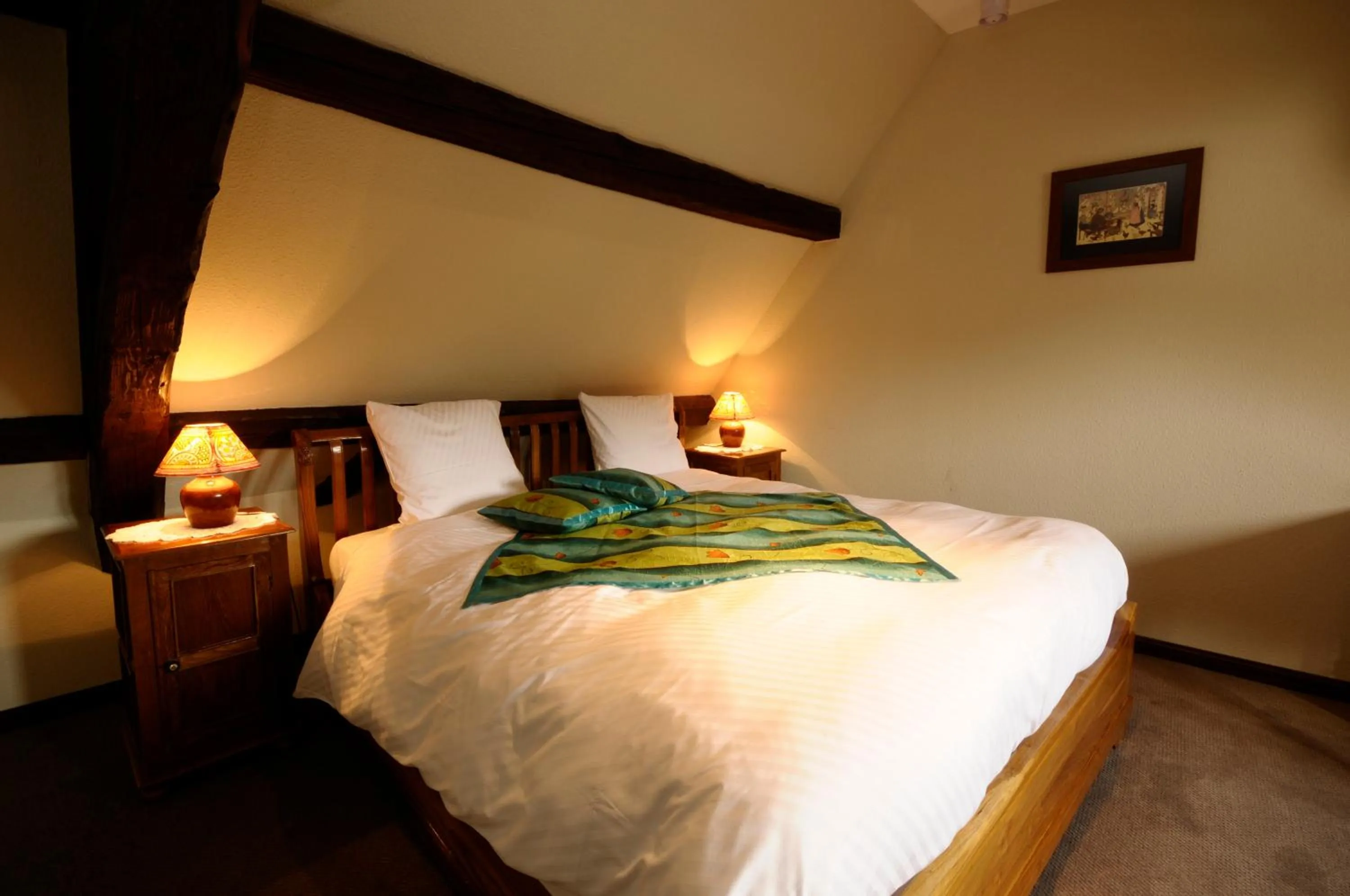 Bed in La Cour du Bailli Suites & Spa