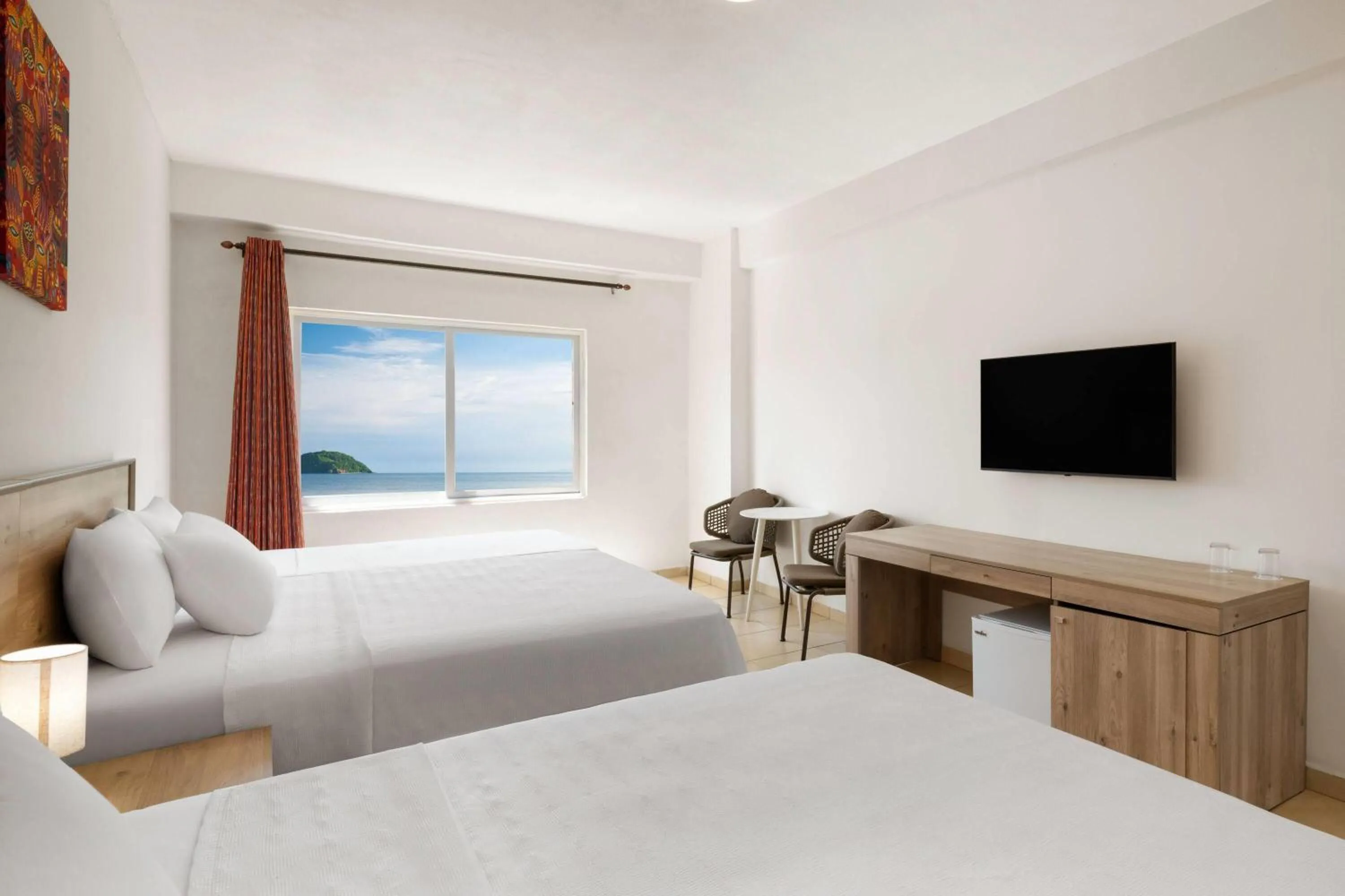 Photo of the whole room, Bed in Decameron Isla Coral Guayabitos, Ramada All-Inclusive Resort