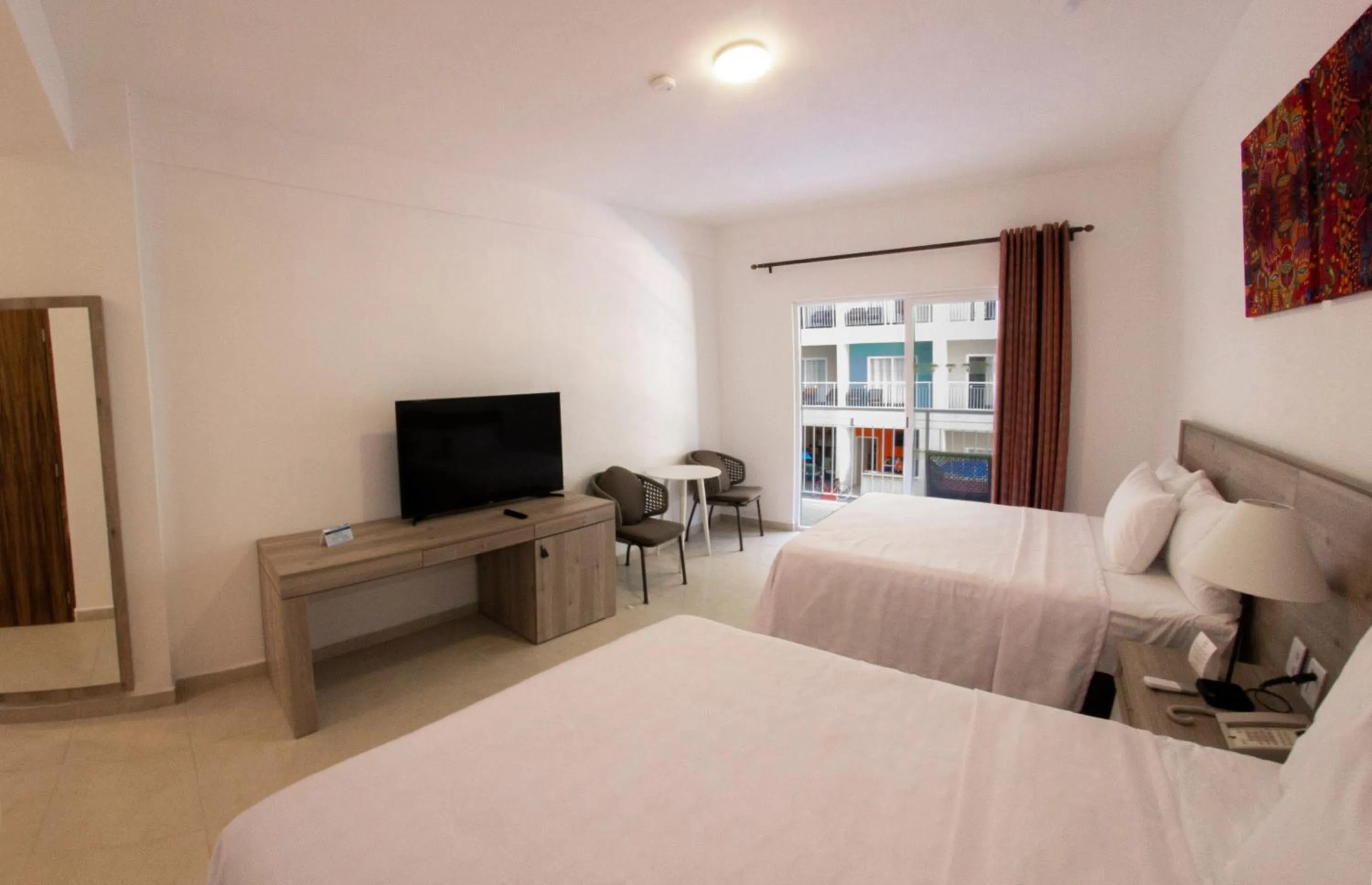 Bed in Decameron Isla Coral Guayabitos, Ramada All-Inclusive Resort