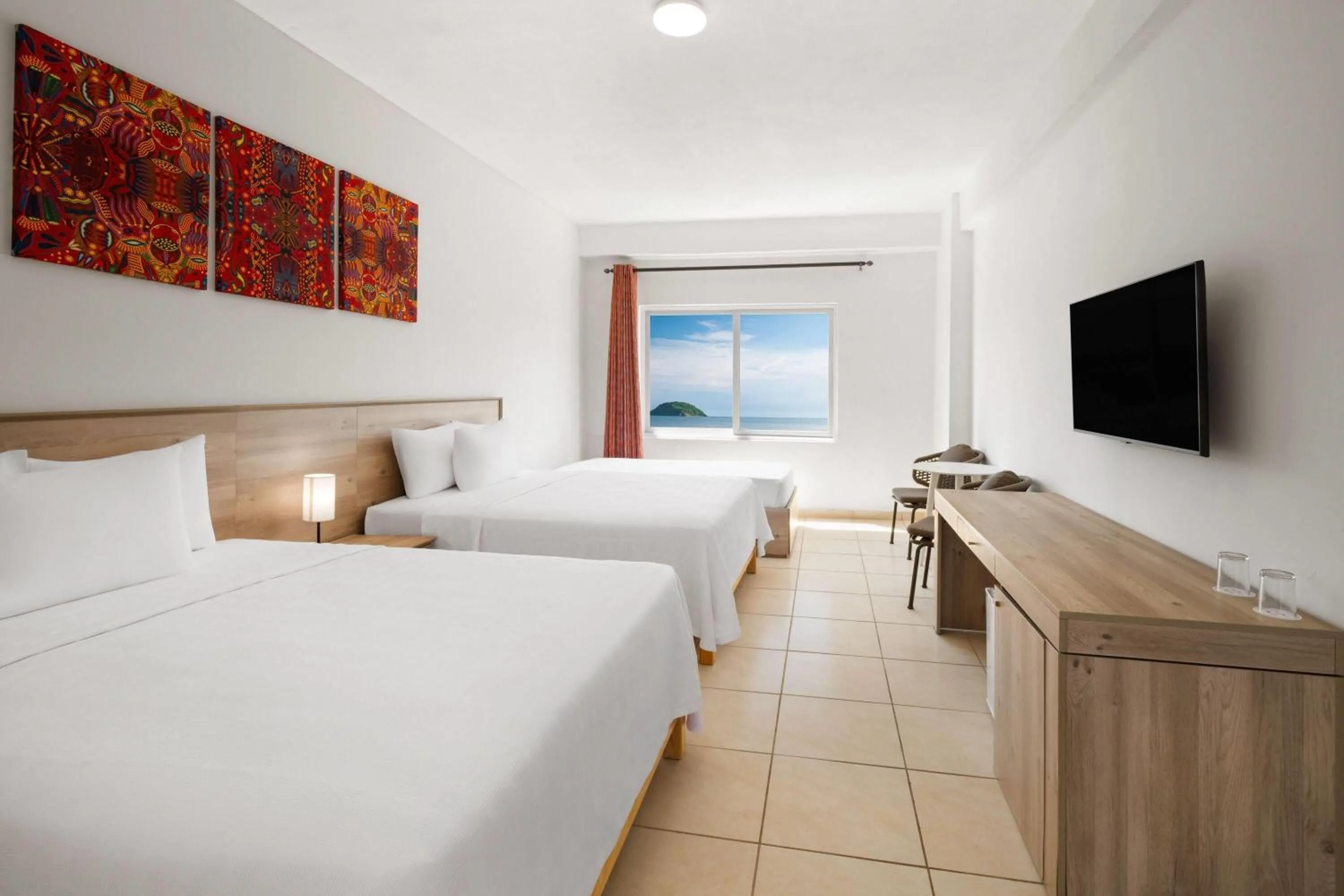 Photo of the whole room, Bed in Decameron Isla Coral Guayabitos, Ramada All-Inclusive Resort
