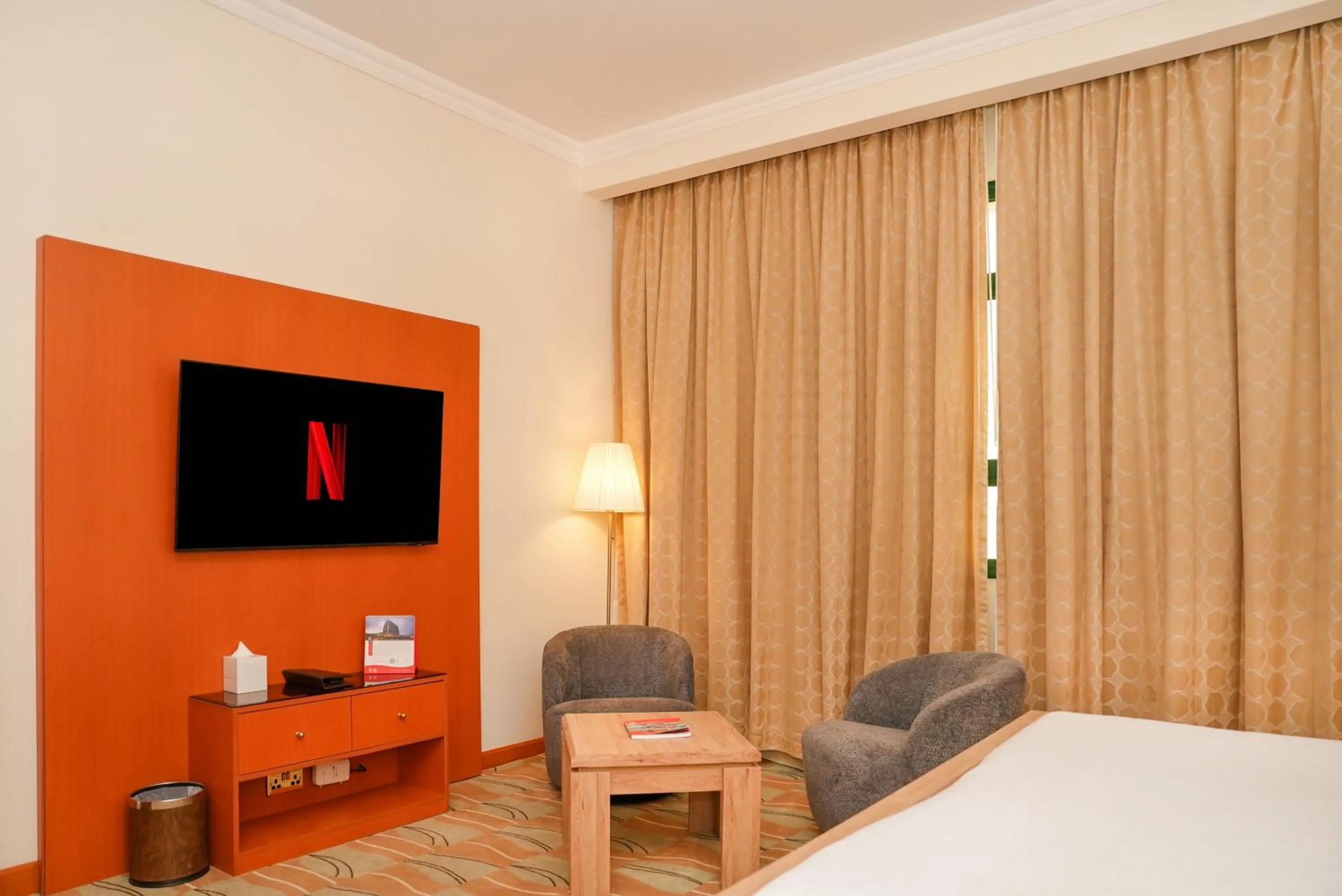 Seating area, Bed in Swiss-Belinn Doha