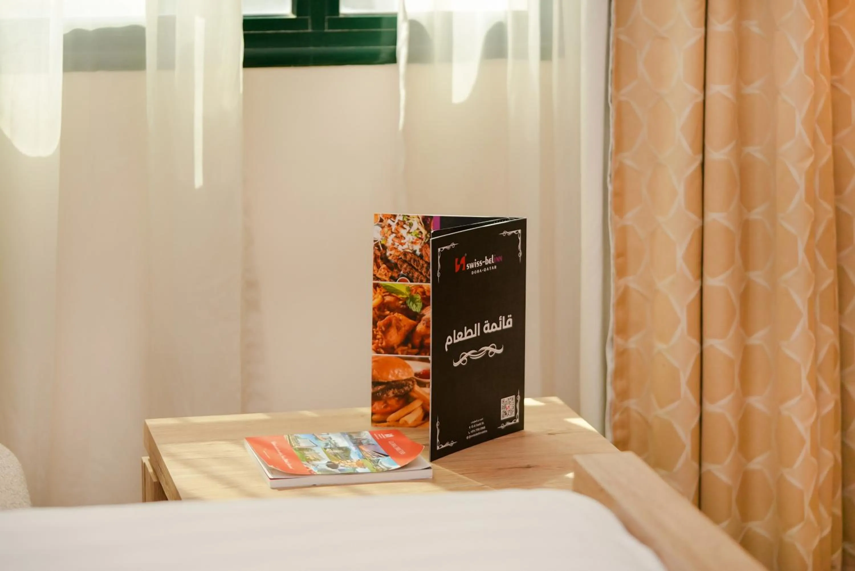 Seating area, Bed in Swiss-Belinn Doha