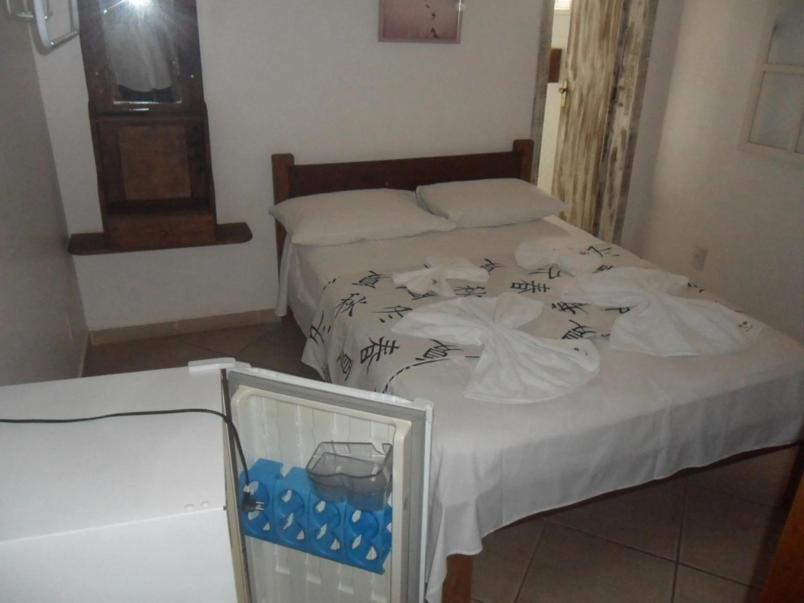 Bed in Pousada La Lampara