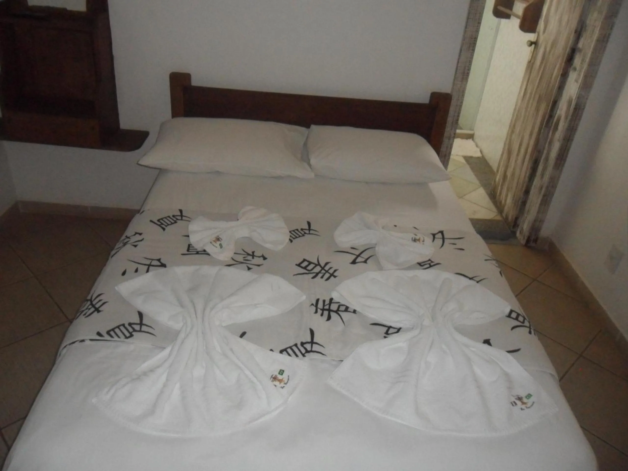 Bed in Pousada La Lampara