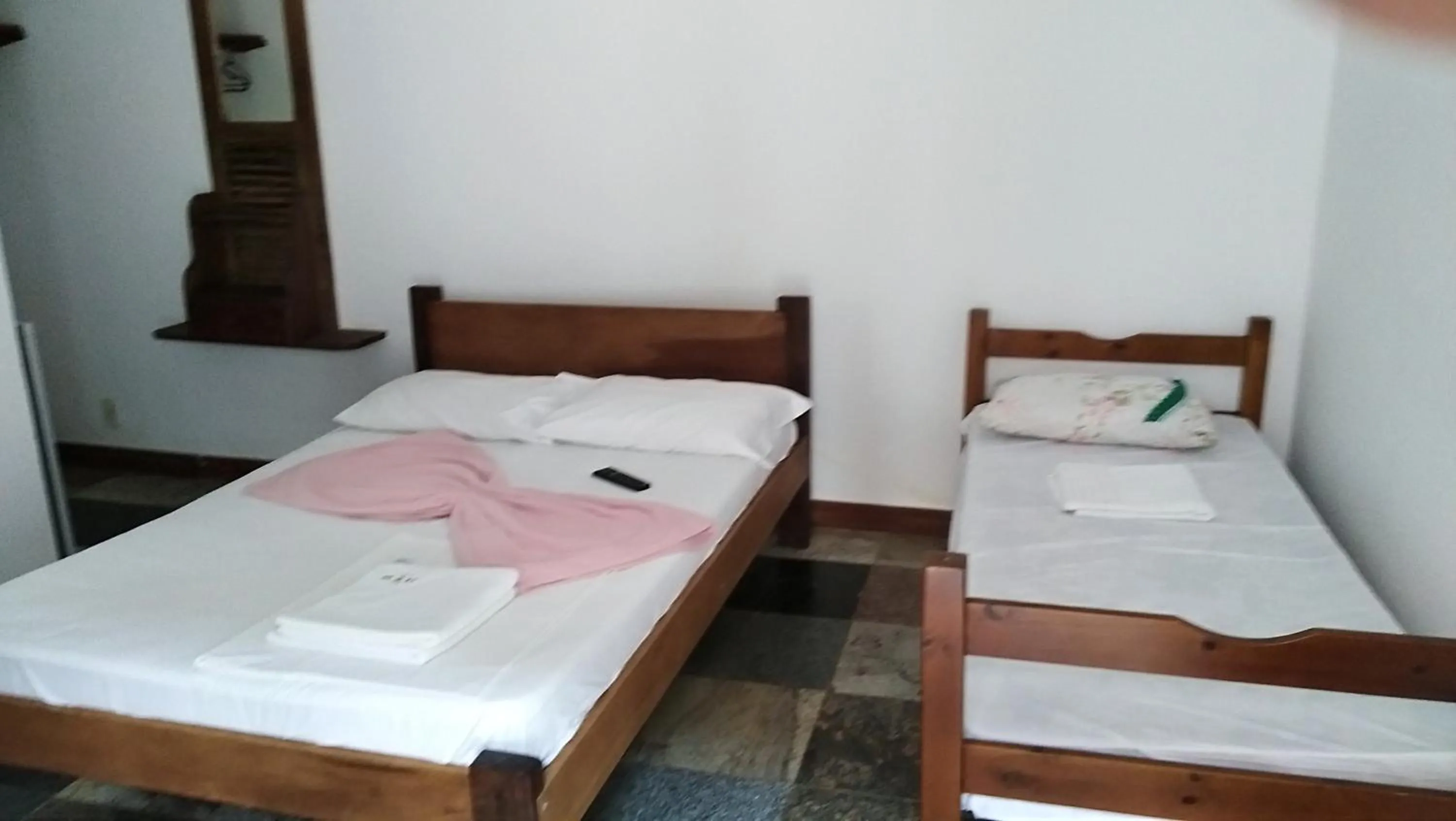 Bed in Pousada La Lampara