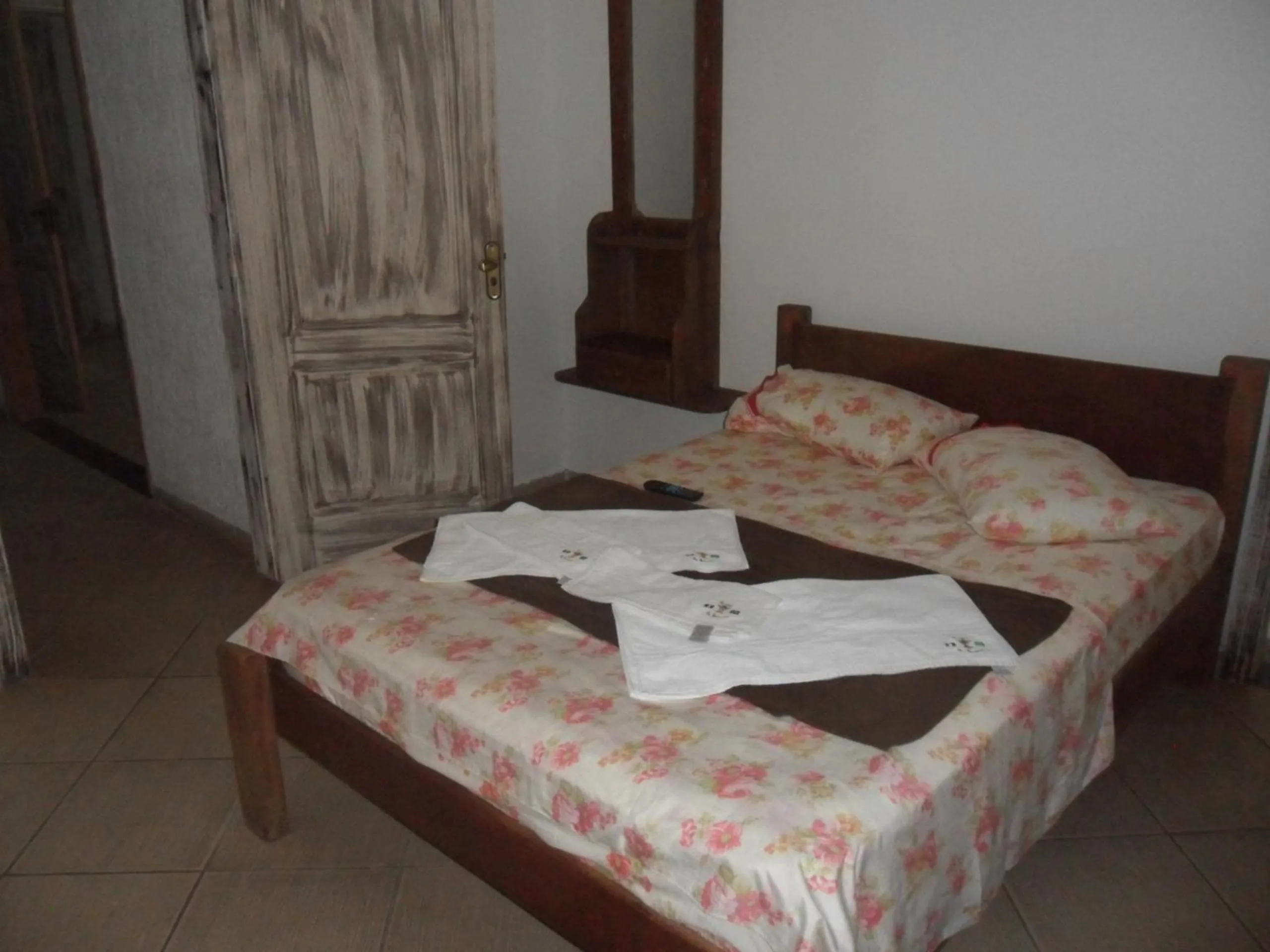 Bed in Pousada La Lampara
