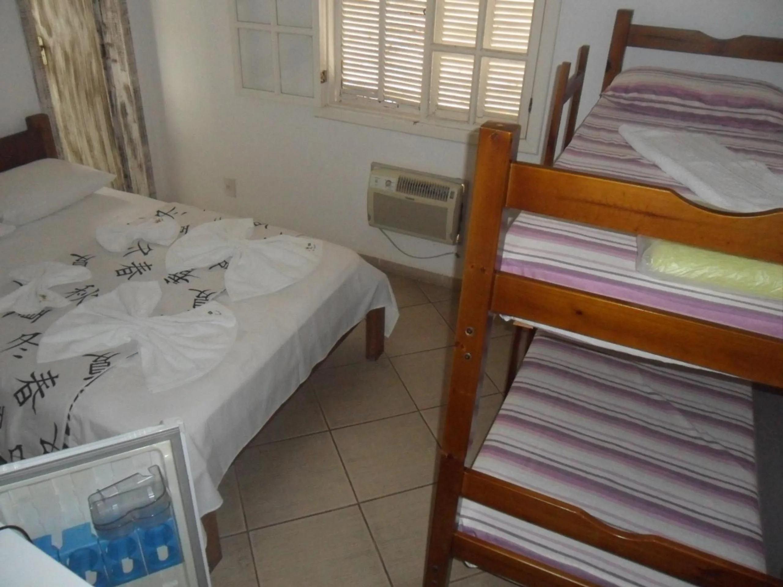 Bed in Pousada La Lampara