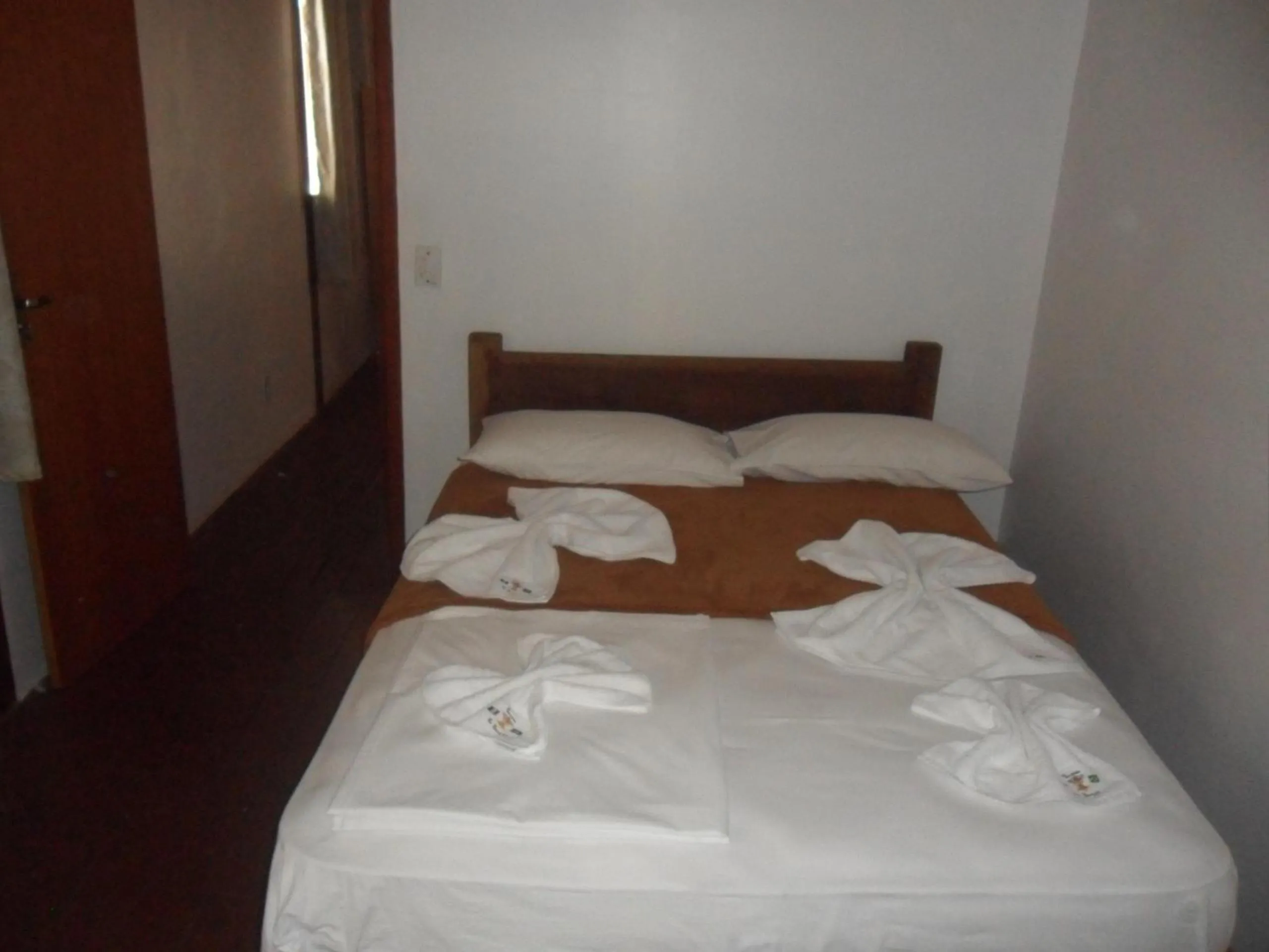 Bed in Pousada La Lampara