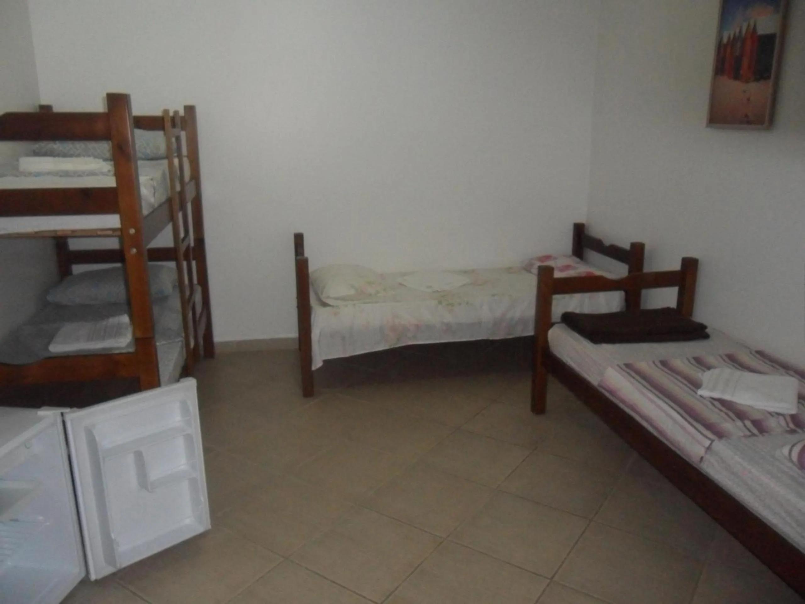 Bed in Pousada La Lampara