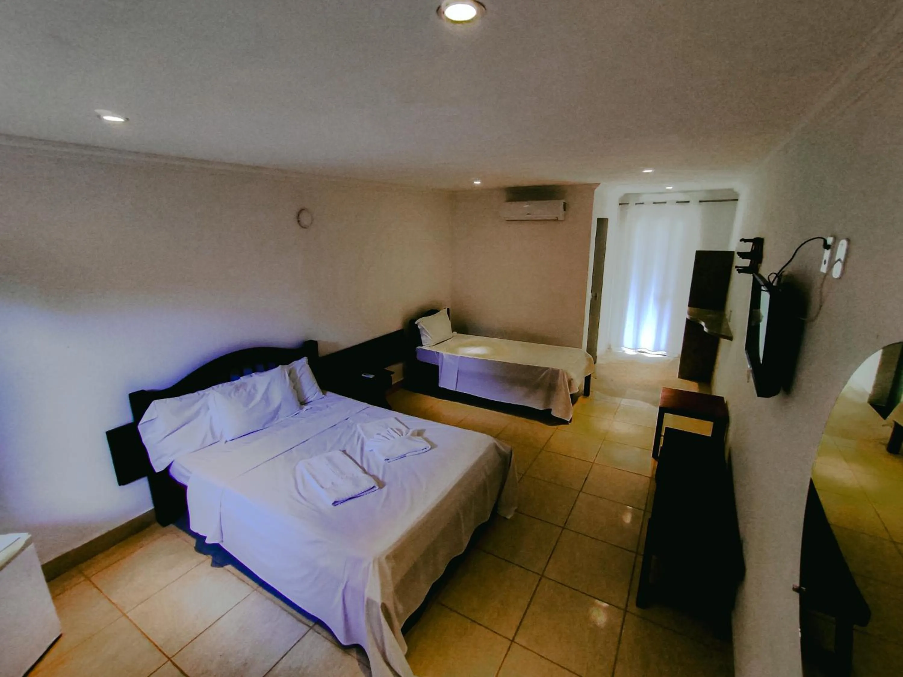 Bed in Pousada Água de Fuego